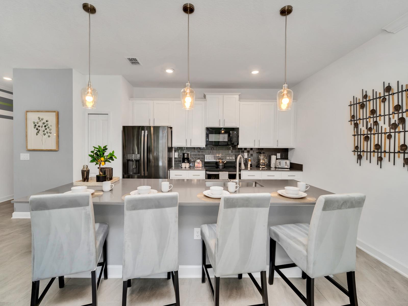 The Kitchen combines functionality with style. With its spacious countertops and convenient table, it offers guests a versatile space for meal preparation, dining, and socializing.