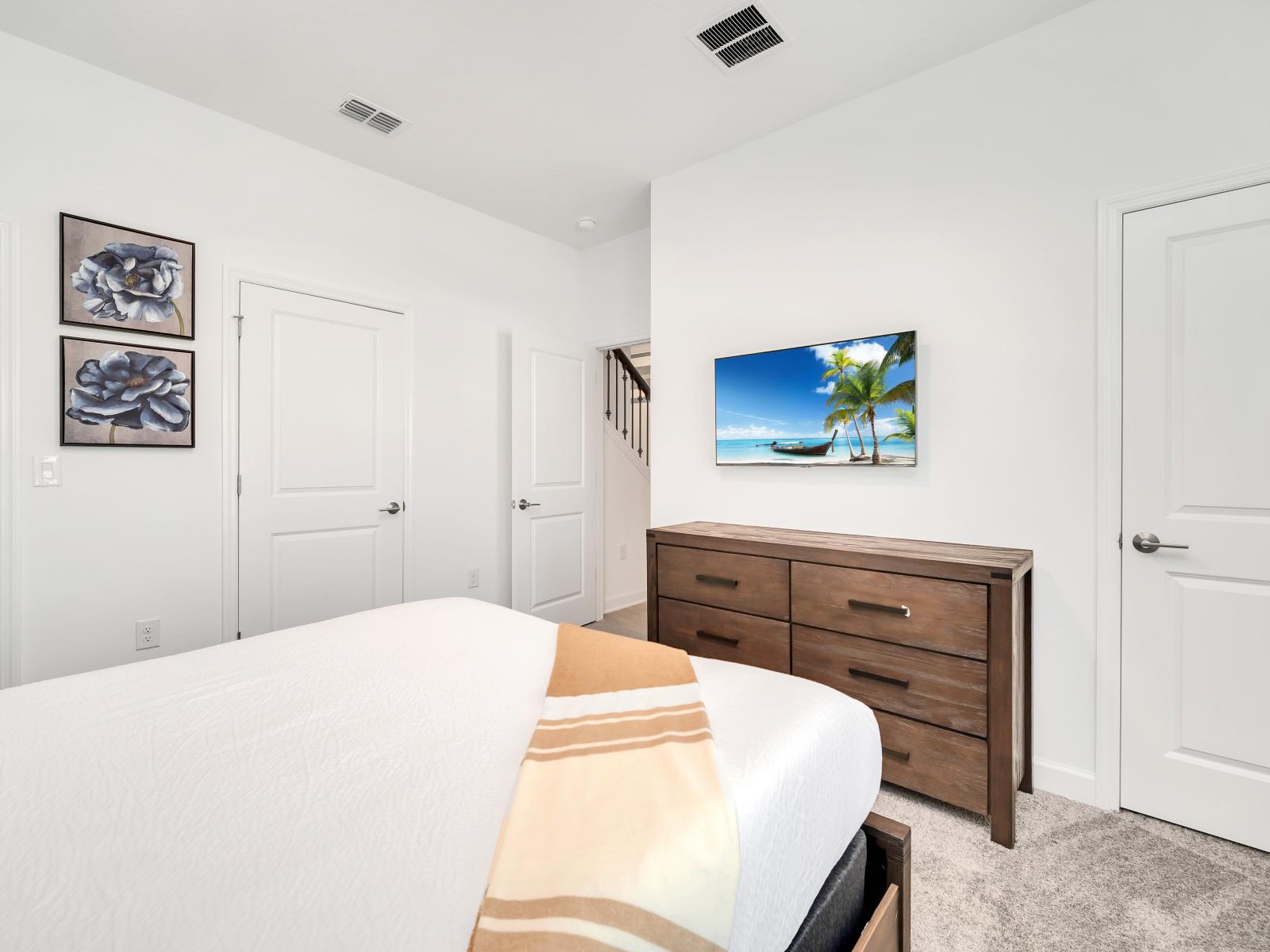 The bedroom has cozy furnishings, serene ambiance, and thoughtful design, it offers a peaceful sanctuary for rest and relaxation during your stay.