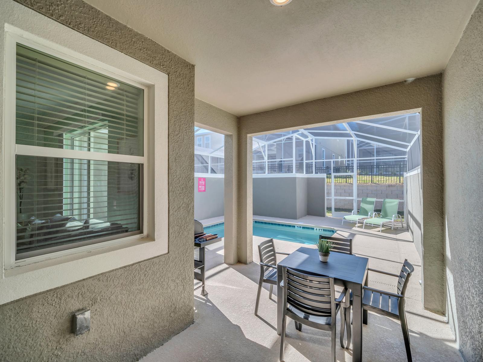 The patio dining area by the pool offers guests a delightful opportunity to enjoy meals al fresco in a picturesque setting.