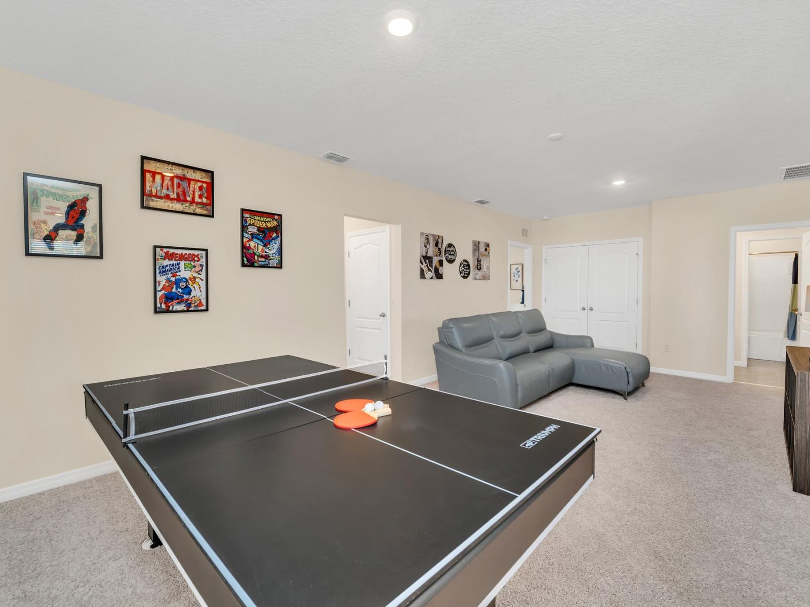 Bright living area with tennis table of the home in Florida - Experience comfort and sophistication in inviting living area - A classic tennis table for fast-paced fun - Plush, comfortable seating perfect for lounging or socializing