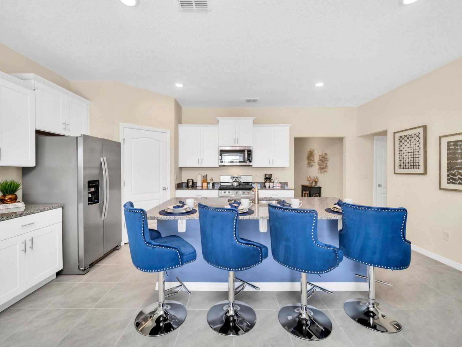 The townhouse kitchen is a sight to behold, featuring an expansive open concept that promotes effortless transition between cooking and socializing.