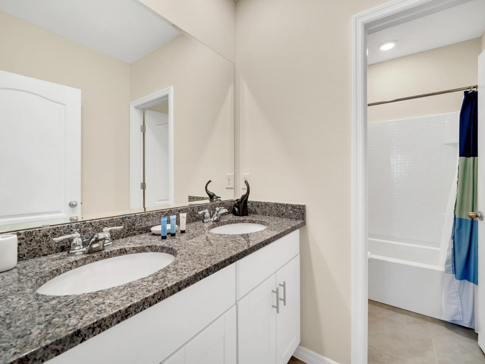 Reinvigorate and refresh your senses in this roomy, modern bathroom, where every bath transforms into a tranquil and opulent experience.