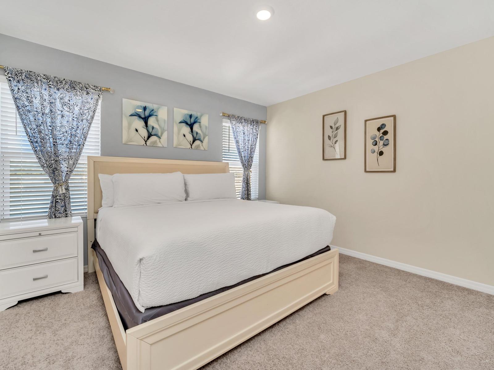 Elegant bedroom of the home in Florida - Minimalist decor, creating a clean and uncluttered sleeping space - Inviting atmosphere designed for a restorative sleep - Spacious bedroom offering comfort and style