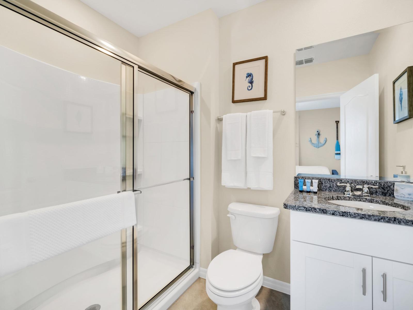 Recharge and renew yourself in this contemporary bathroom, where bath time transcends into a soothing experience.