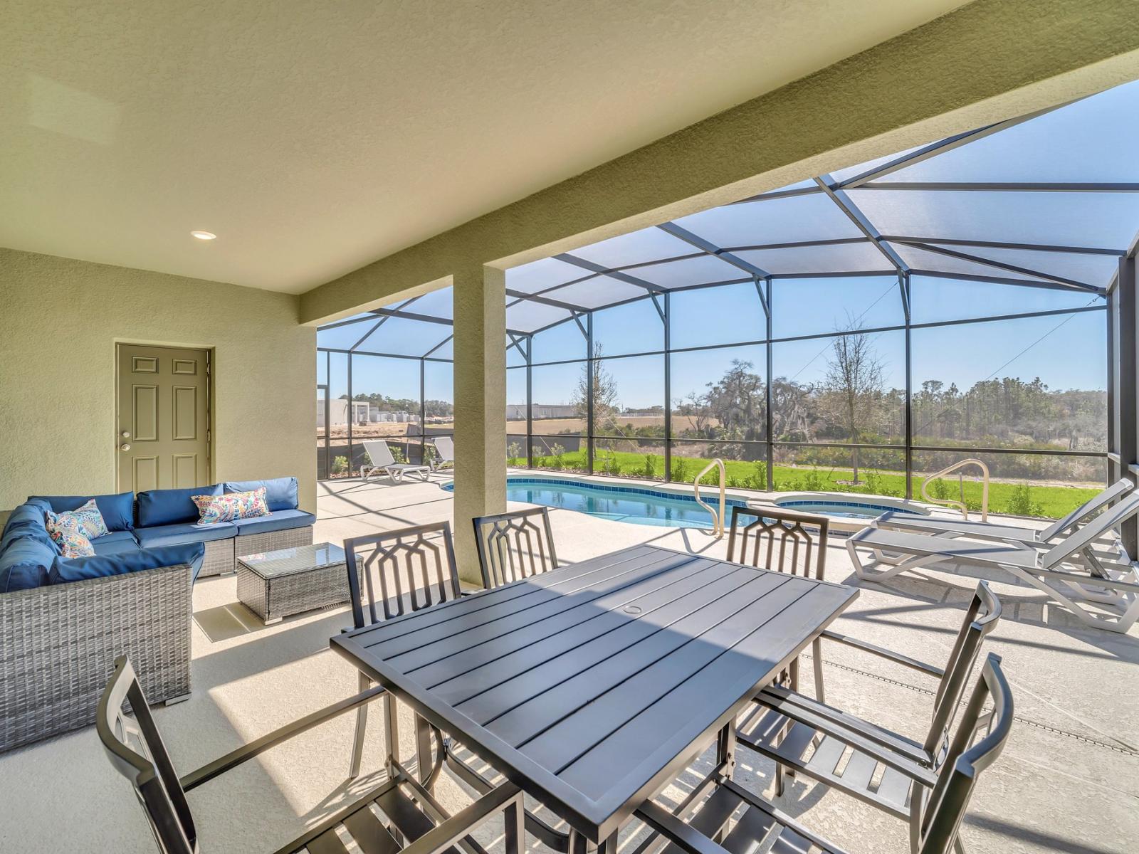 Outdoor dining area of the home in Florida - Savor the flavors of paradise with a side of poolside serenity - Outdoor dining experience offers a feast for the senses - Every meal accompanied by stunning pool views