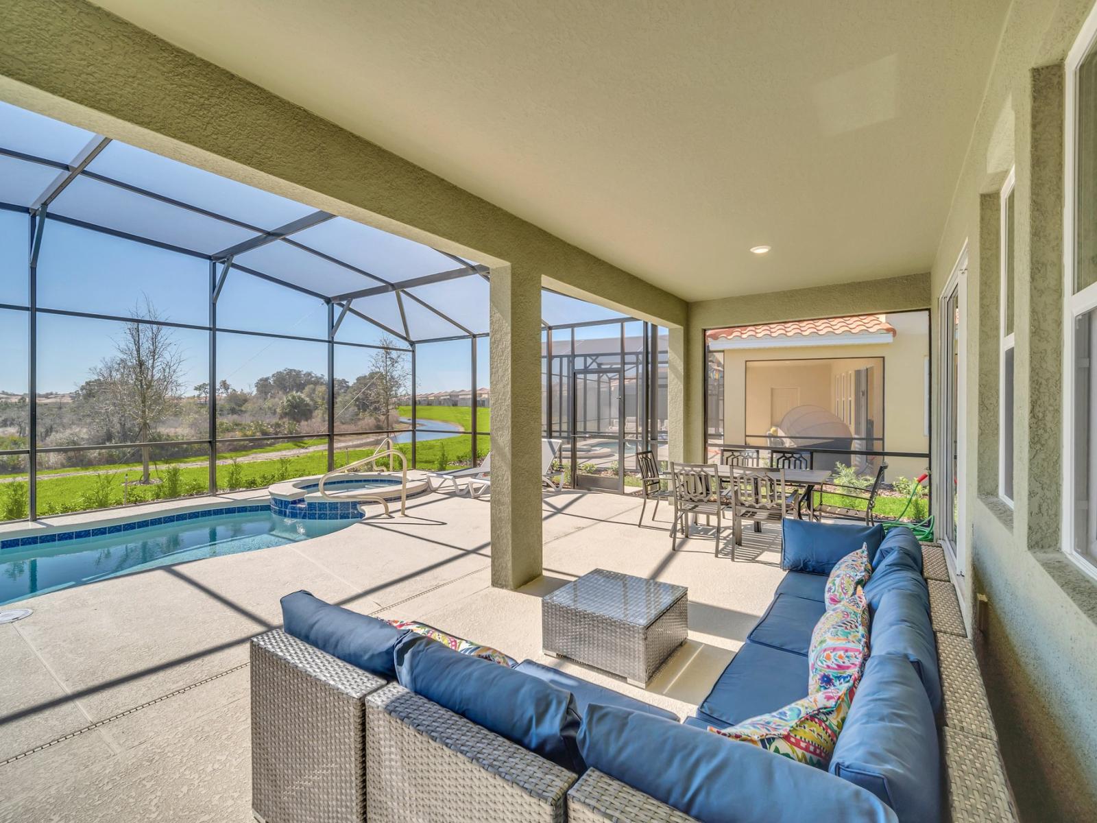 Refreshing outdoor seating area of the home in Florida - Outdoor experience offers refreshment for the senses - Relax and unwind in serene setting - Extends living space for outdoor enjoyment