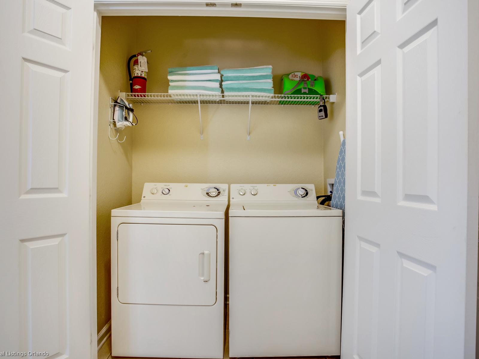 The laundry area boasts a full-size washer and dryer, ensuring that you can easily keep your clothes fresh and clean throughout your stay.