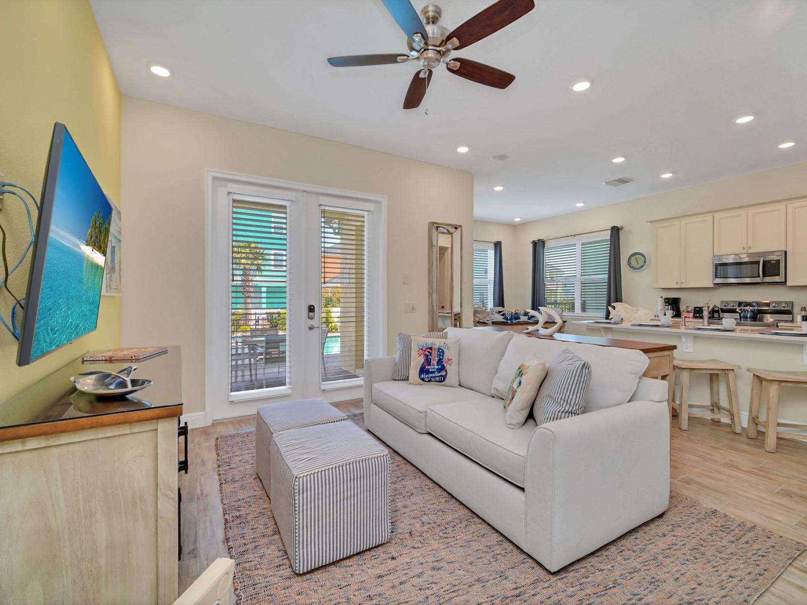 - Spacious living area of the cottage in Reunion Florida - Designed for comfort and entertainment - Your relaxation haven awaits - Smart TV and Netflix - Thoughtful mix of textures, from plush rugs to tasteful throw pillows