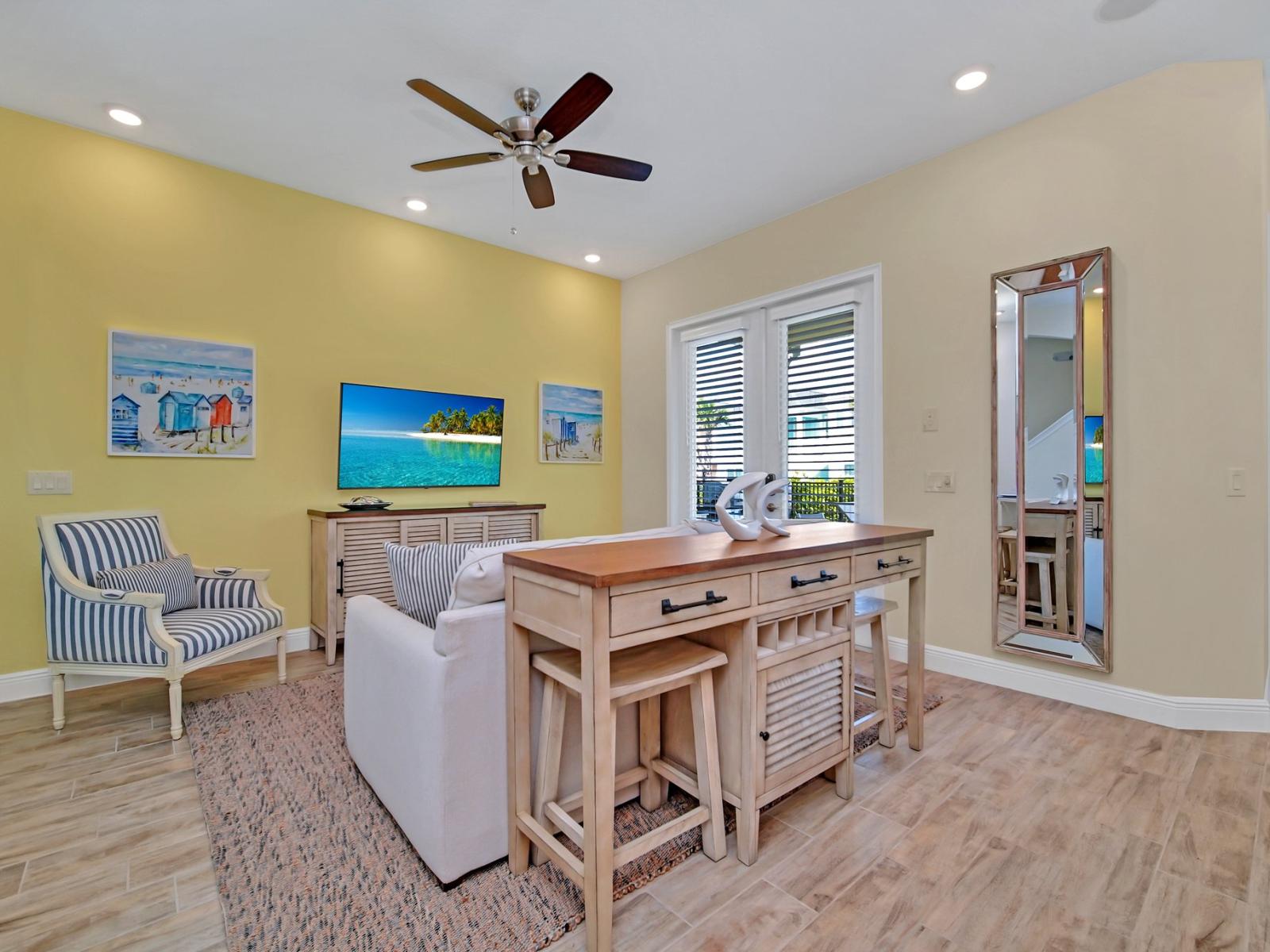 - Sleek living area of the cottage in Reunion Florida - Stylish furniture arrangement providing comfort and a cohesive look - Smart TV and Netflix - Harmonious color scheme with pops of accent colors for visual interest