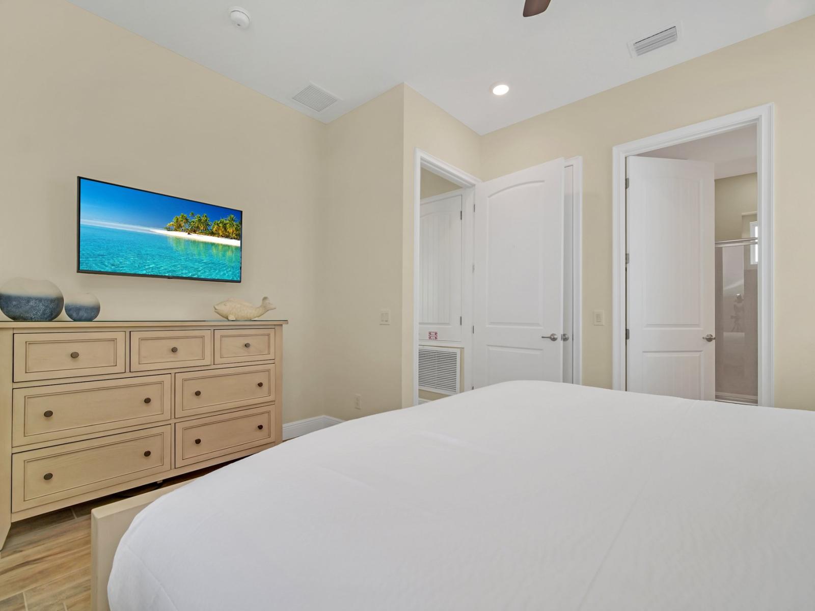 Ultimate Retreat: Recharge in our bedroom, complete with an entertainment-ready TV and a lavish ensuite bathroom, offering the pinnacle of relaxation.