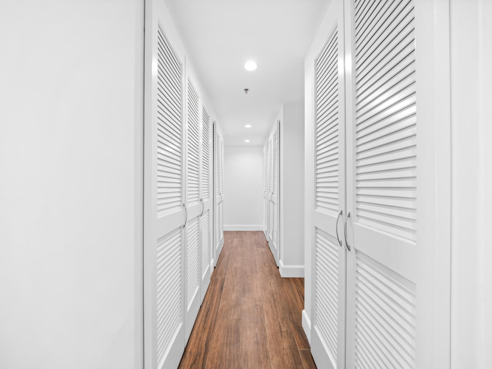 Hallway to the bedrooms, plenty of closet space