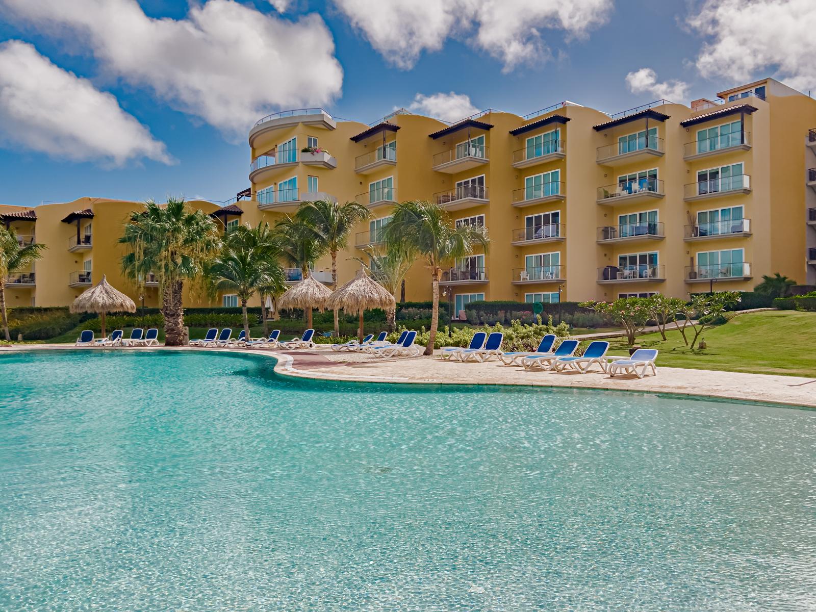 Enjoy resort-style living with our large shared pool, perfect for refreshing swims and leisurely afternoons under the clear blue sky.