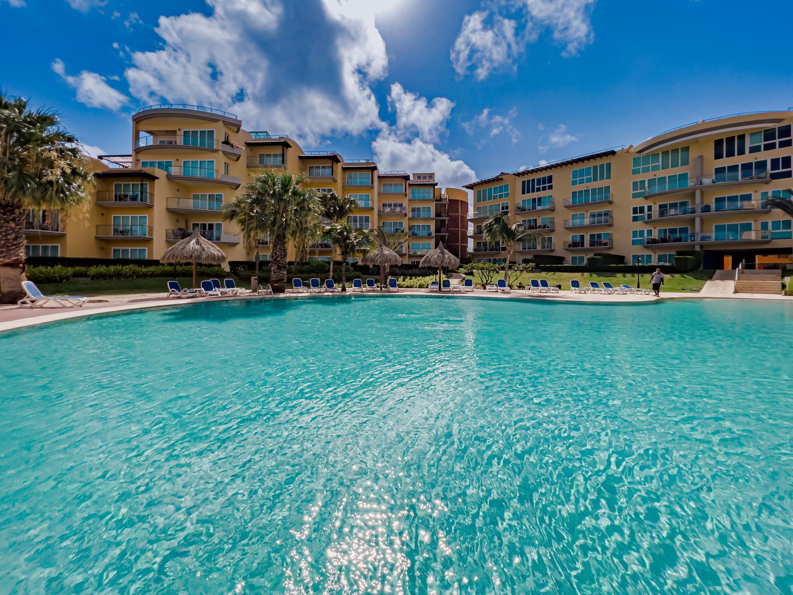 Escape to our luxurious shared pool oasis, offering ample space for everyone to unwind and enjoy the ultimate poolside experience.