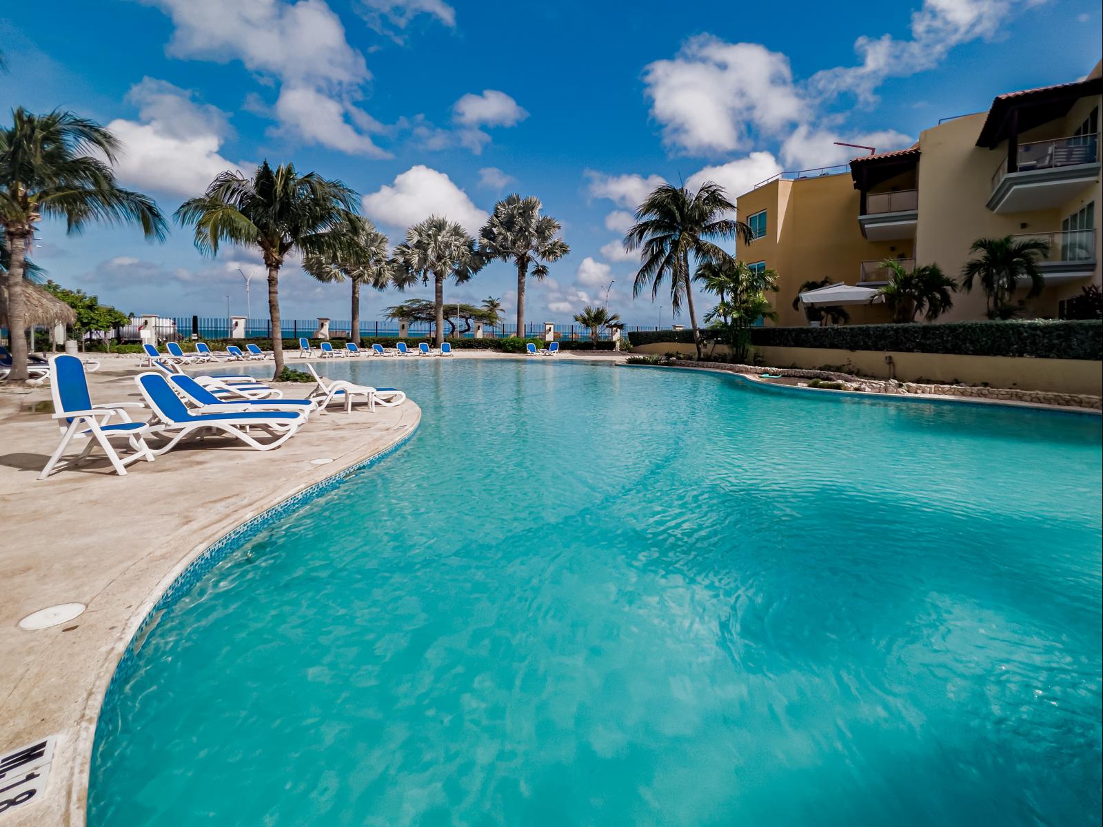 Dive into luxury at our expansive shared pool, where relaxation and fun come together in a stunning setting.