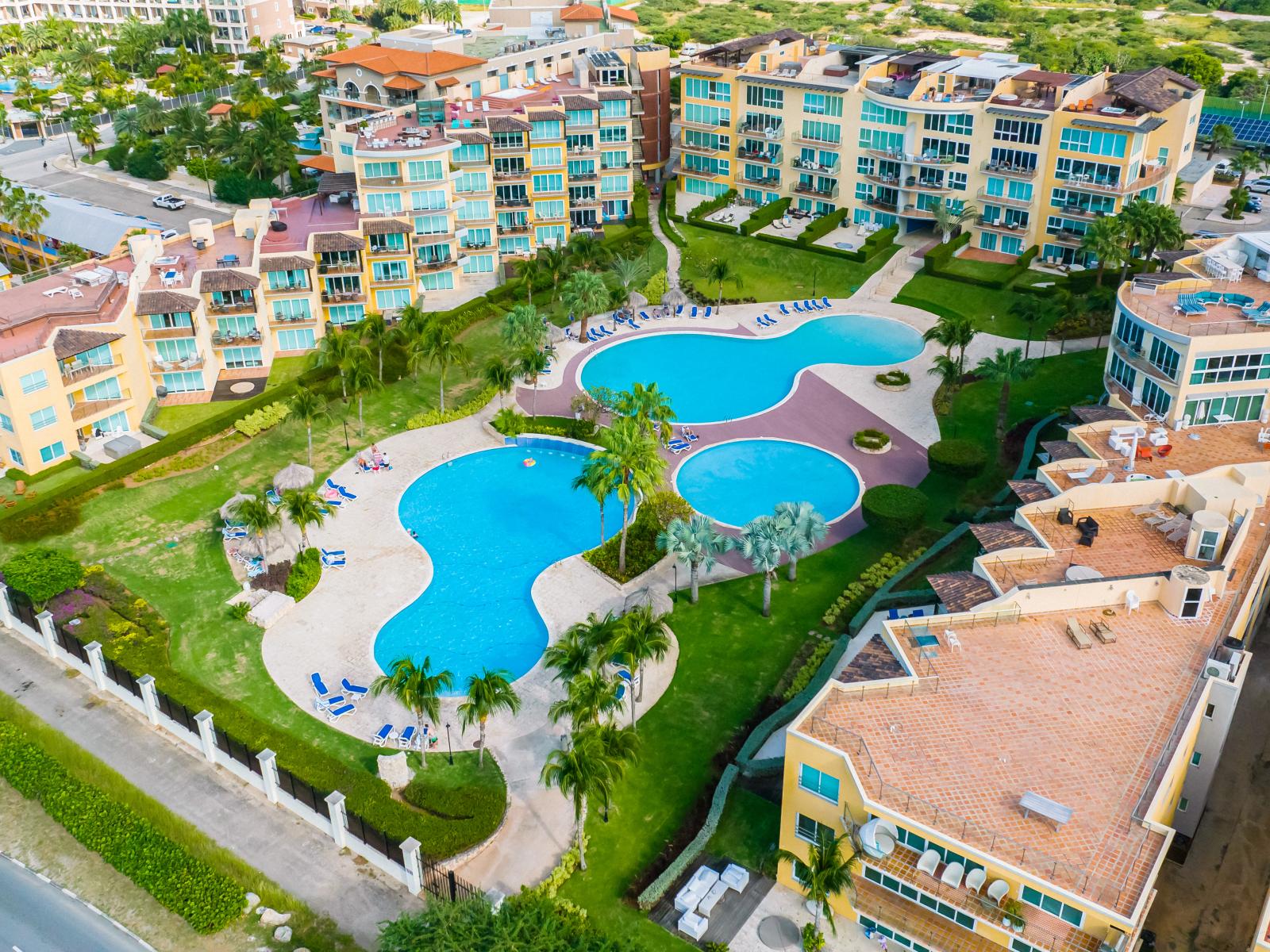 Take in the expansive view of our large pool from above, where shimmering waters beckon you to relax and unwind in style.