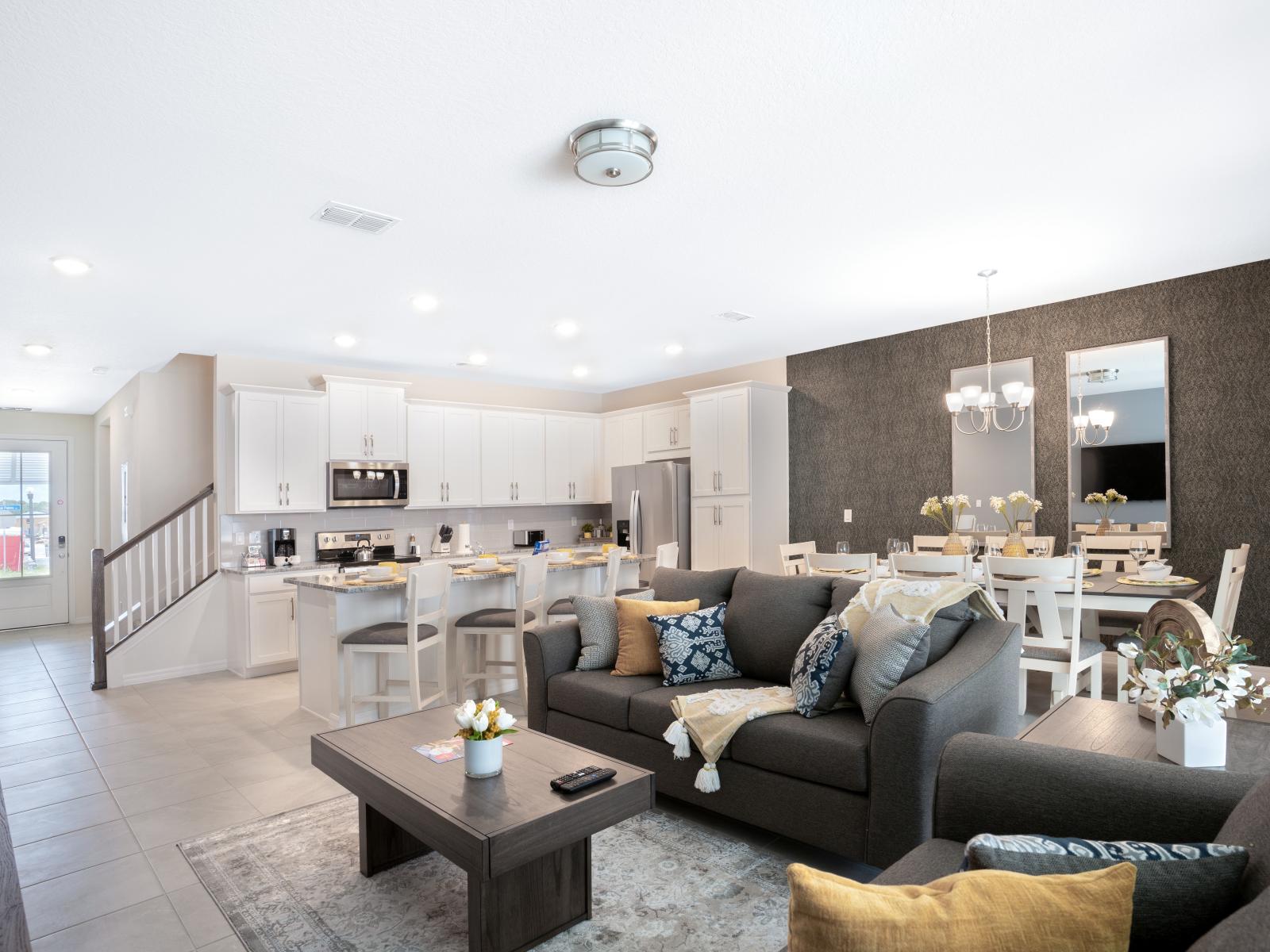 Spacious living area of the townhouse in Four Corners Florida - Watch your favorite shows on the smart TV - Stylish furniture arrangement providing comfort and a cohesive look - Cozy seating area conducive to relaxation and socializing