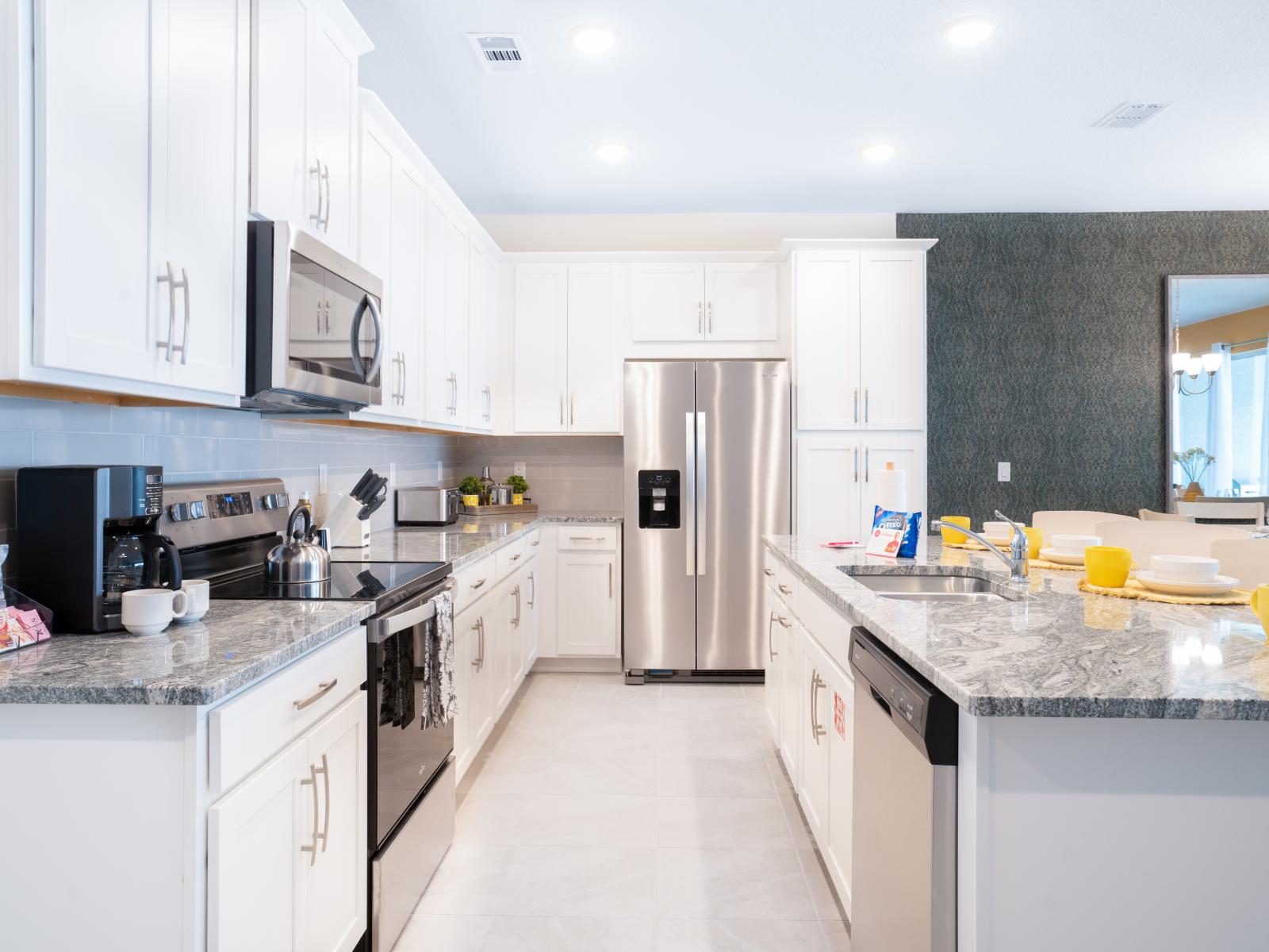 Bright kitchen of the townhouse in Four Corners Florida - Fully equipped - Contemporary design with clean lines and minimalist aesthetics - Thoughtful placement of kitchen essentials for easy access