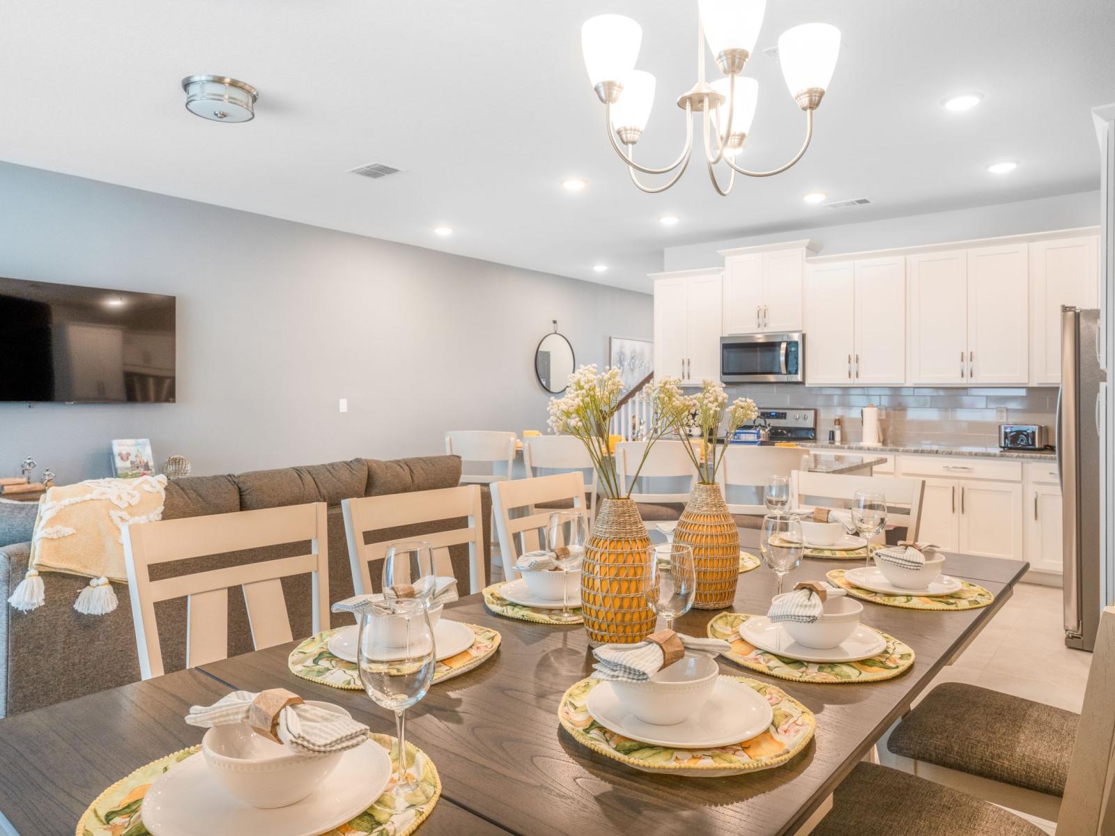 Sleek townhouse in Four Corners Florida - Open layout seamlessly connecting the dining area to the kitchen and living area - Plush and comfortable seating arrangements - Stylish, contemporary furnishings enhancing the aesthetic