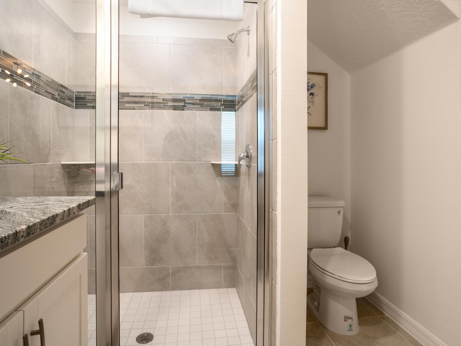 What could be better than a warm, comforting shower in this spotless bathroom with a walk-in shower.