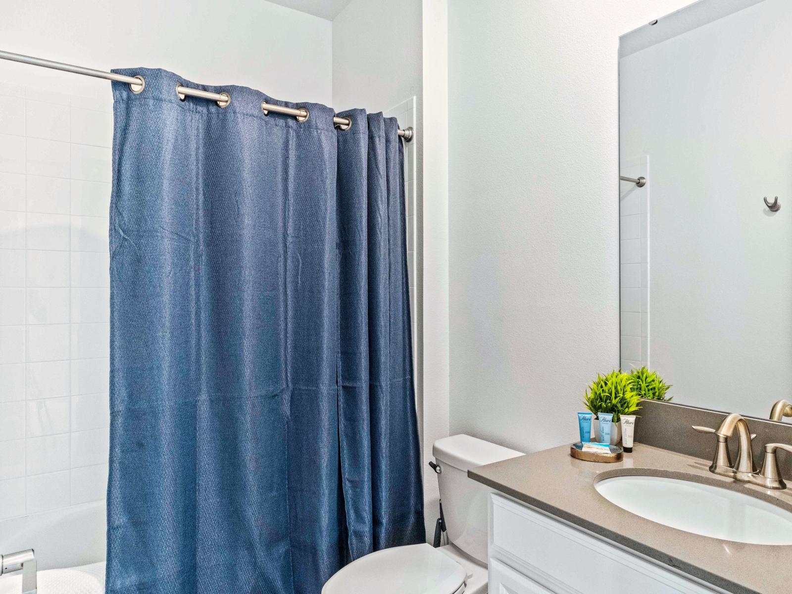 Exclusive Bathroom of the Home in Davenport Florida - Neat and clean toilet seat - Availability of all bathroom amenities - Beautiful large vanity with large size mirror  - Elegant lighting