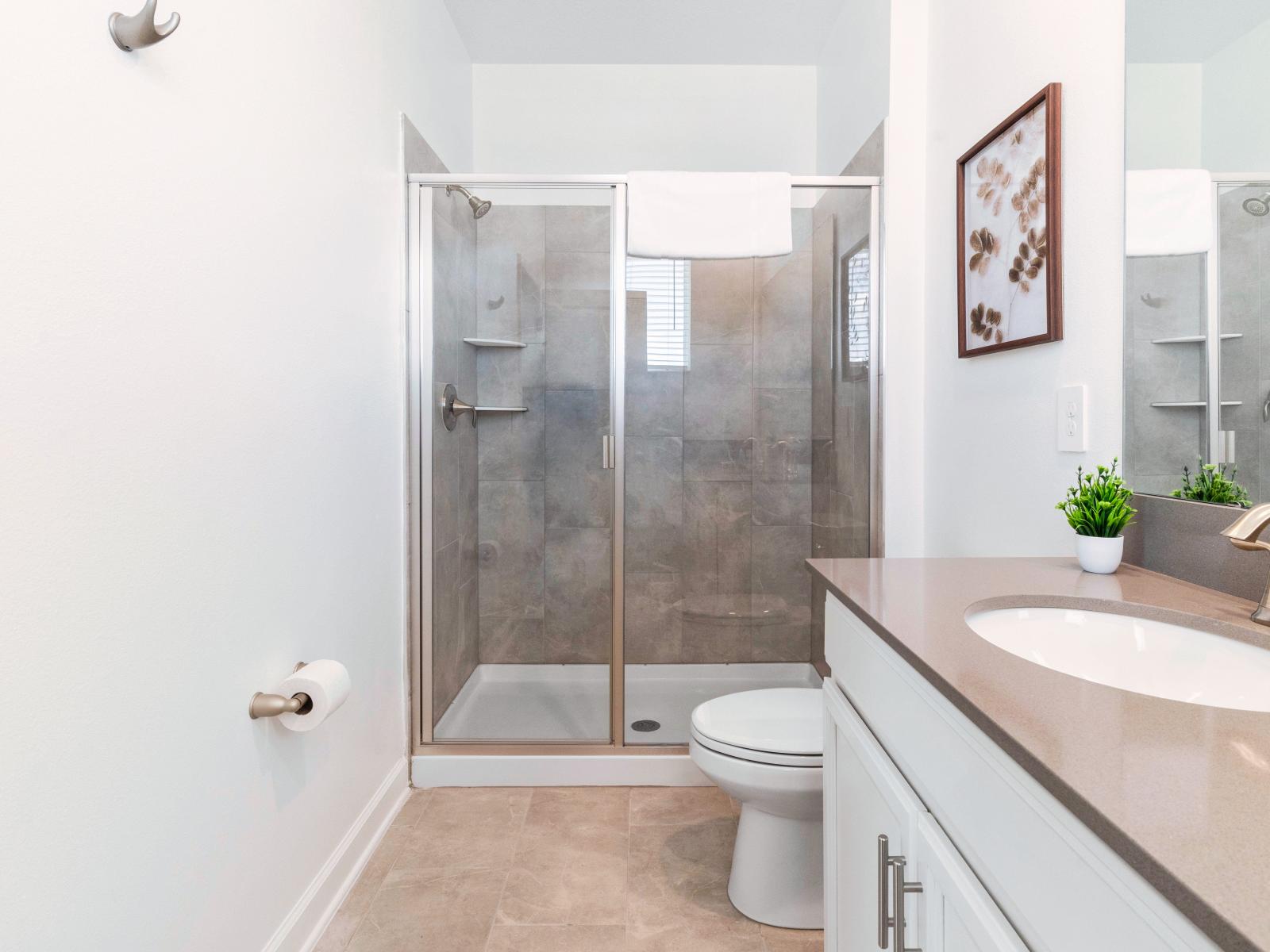 Serene Bathroom of the Home in Davenport Florida - Step into pure bliss at its pristine bathroom - Every detail is designed for your ultimate comfort and relaxation - Refresh, rejuvenate, and revel in the indulgence of pure cleanliness