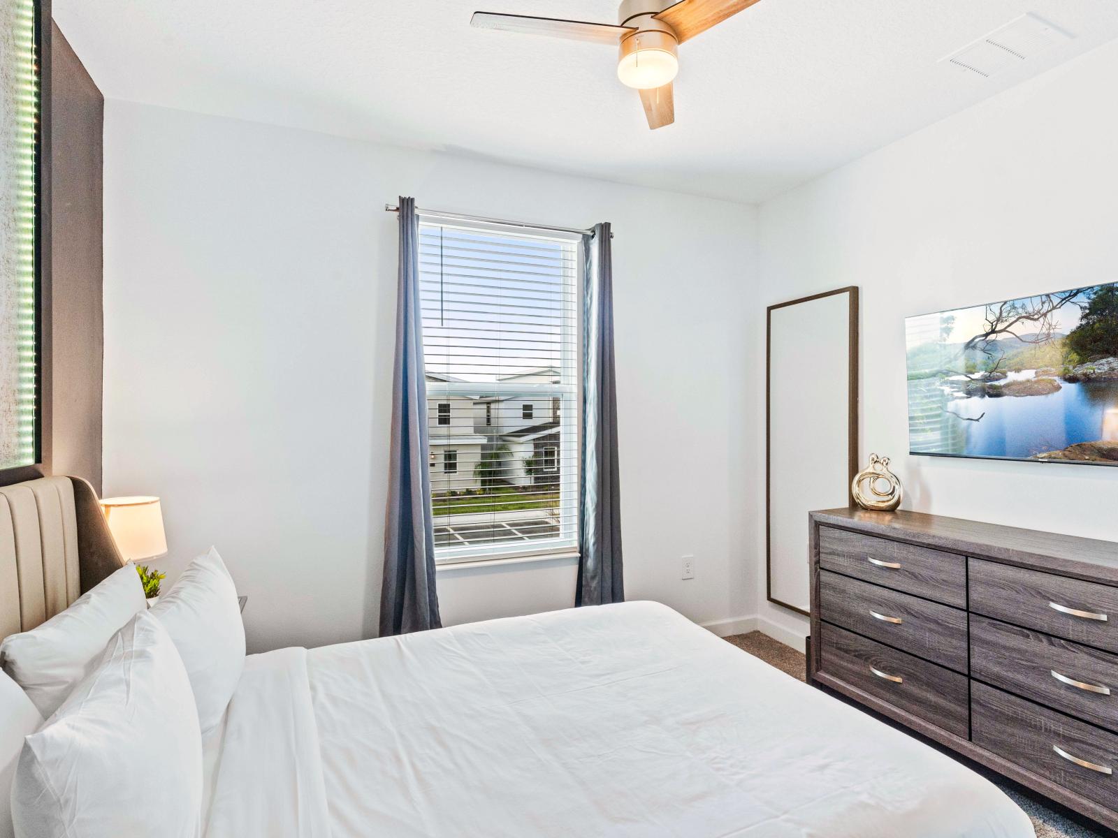 Welcoming Bedroom of the Home in Davenport Florida - The bedroom where every moment is infused with the promise of relaxation and rejuvenation - Smart TV and Netflix - Full Length Mirror