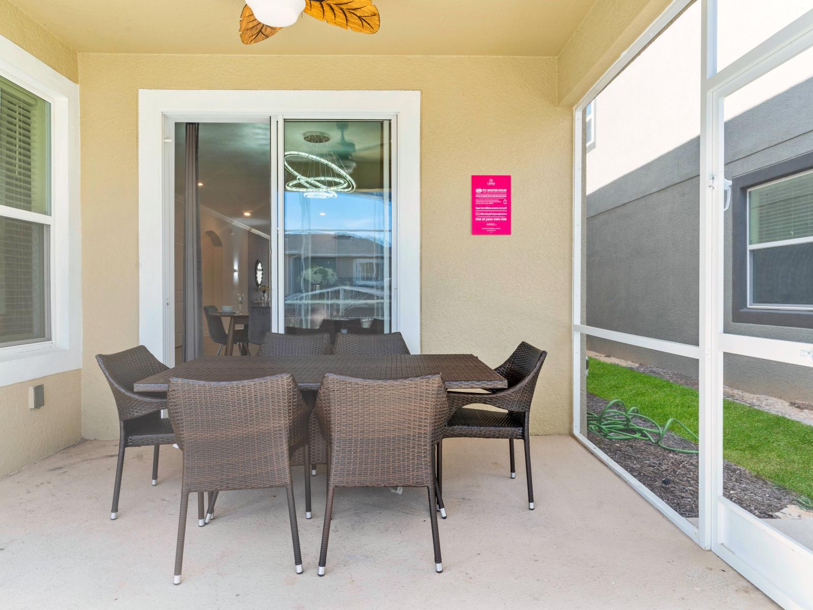 Refreshing Outdoor Dining Area of the Home in Davenport Florida - Al fresco elegance awaits at the outdoor dining area  - Every meal is savored under the open sky - Amidst the gentle breeze and the sounds of nature - Bon appétit!