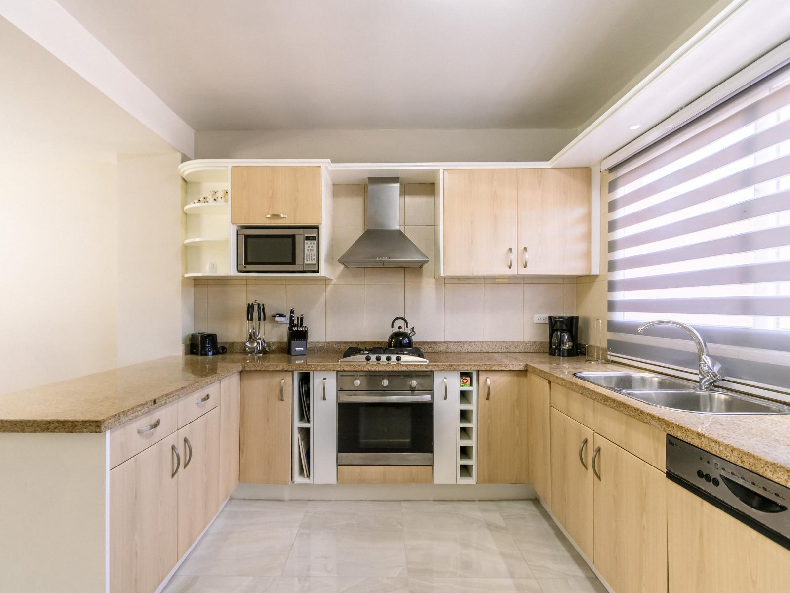 Modern Kitchen Area of the 3BR Condo in Oranjestad Aruba - Fully Equipped - Functional layout designed - Storage space for organized and clutter-free counters - Integrated Appliance