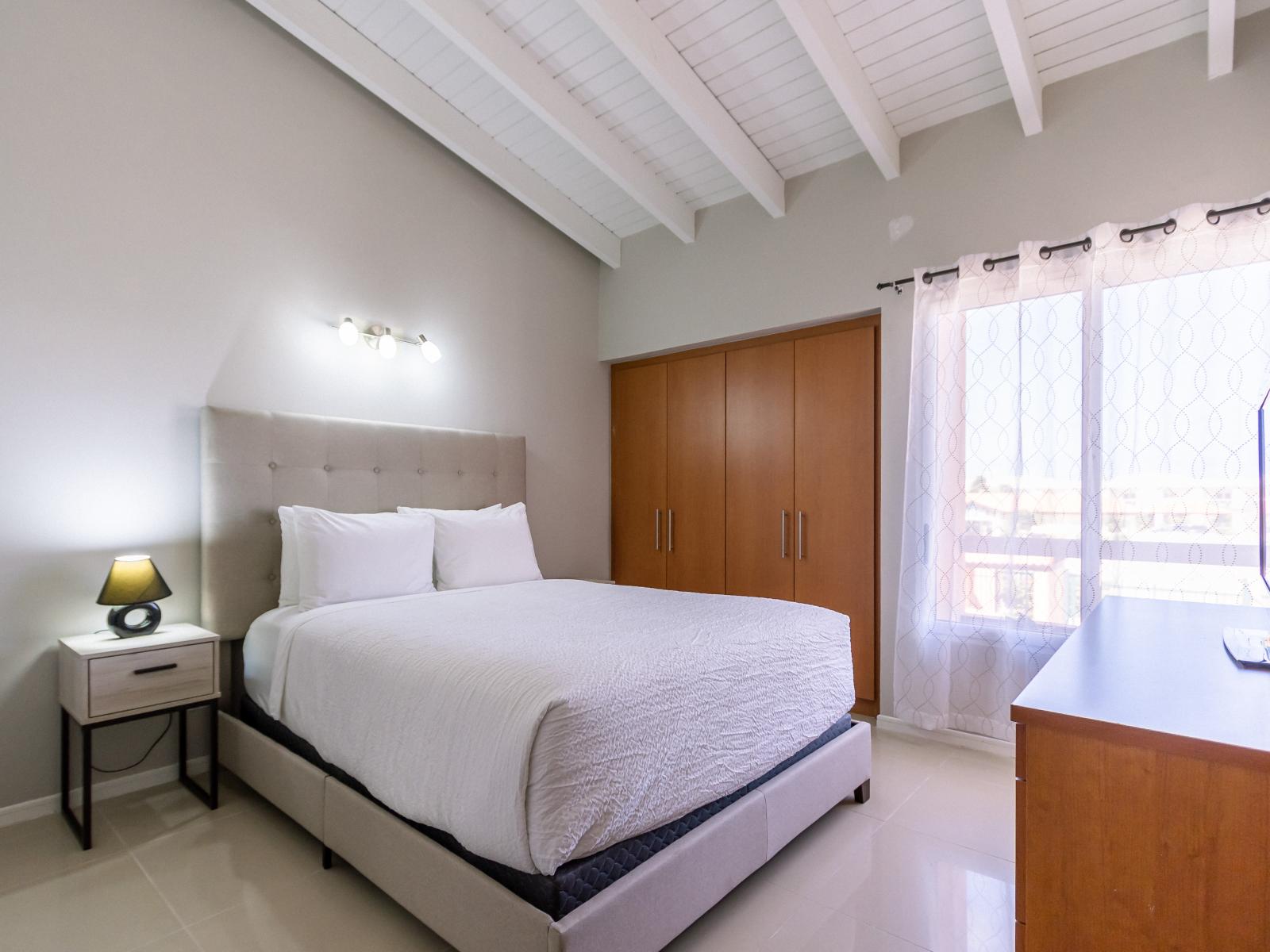 Your private haven: the second bedroom offers a queen bed and ensuite bathroom, ensuring a comfortable stay.