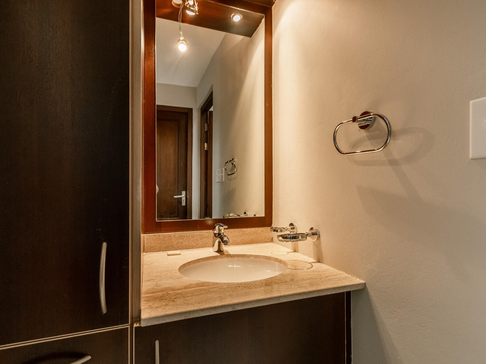 Escape to comfort: the ensuite bathroom of the third bedroom offers a serene space to unwind and recharge.