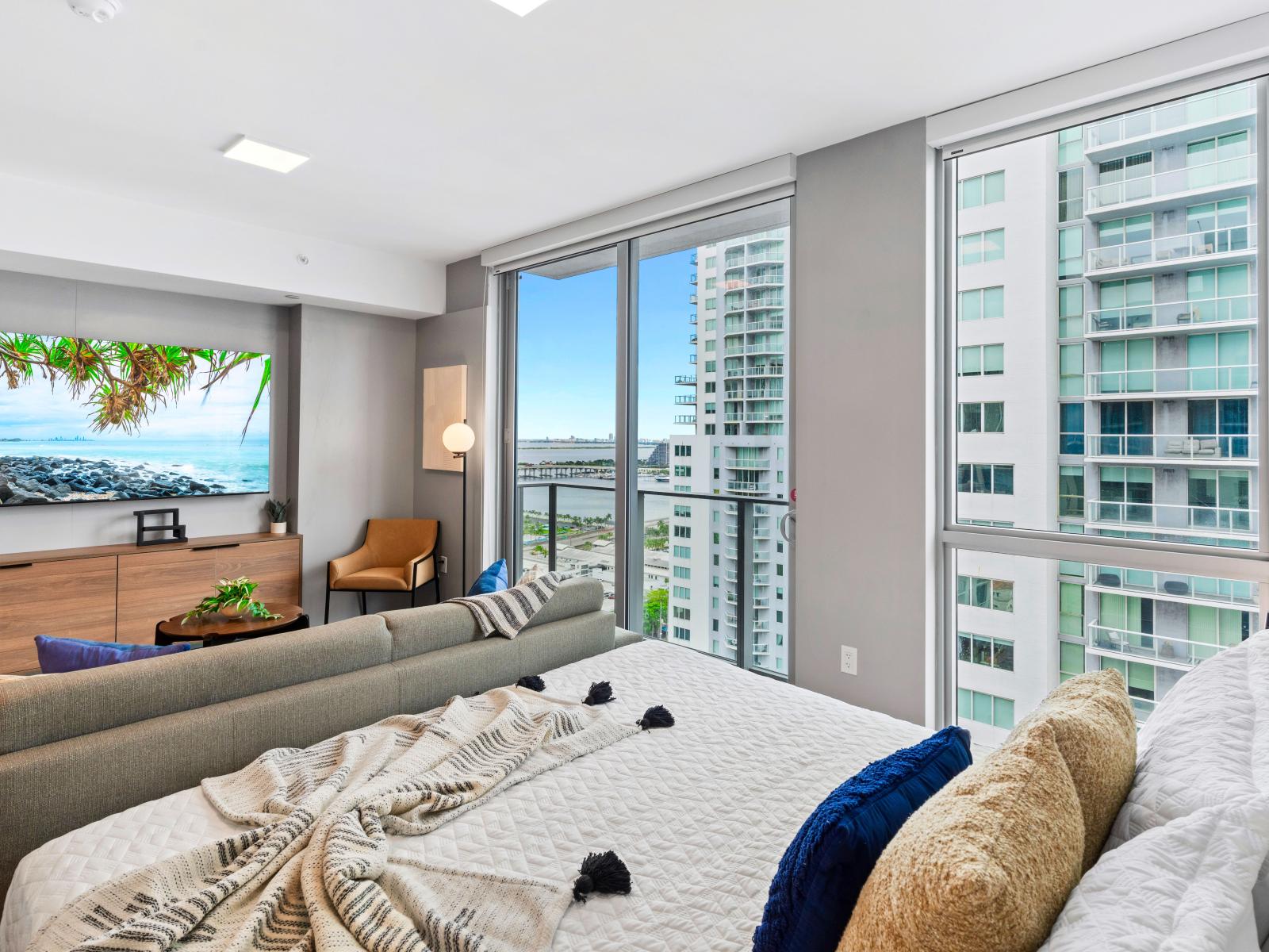 Living/sleeping area w/ king bed, 65" Smart TV - Capturing the amazing views of the city from your own spot at this charming studio apartment.