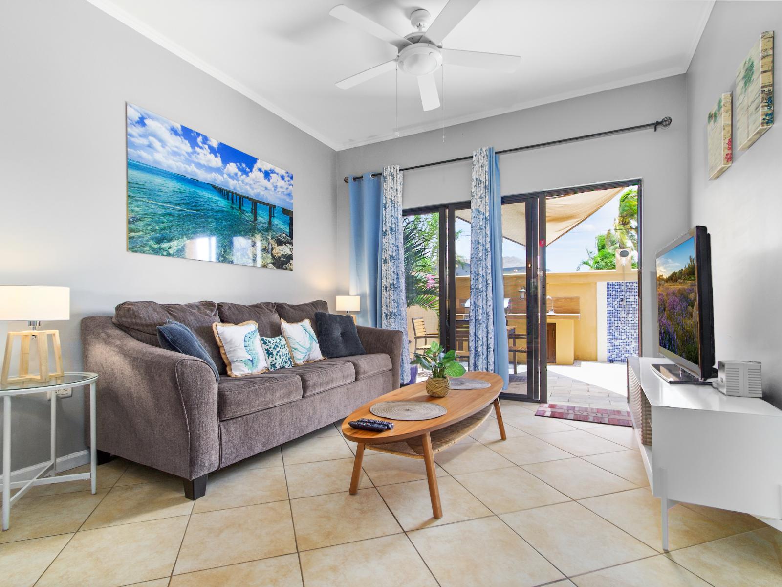 Living area has access to the backyard with glass sliding doors