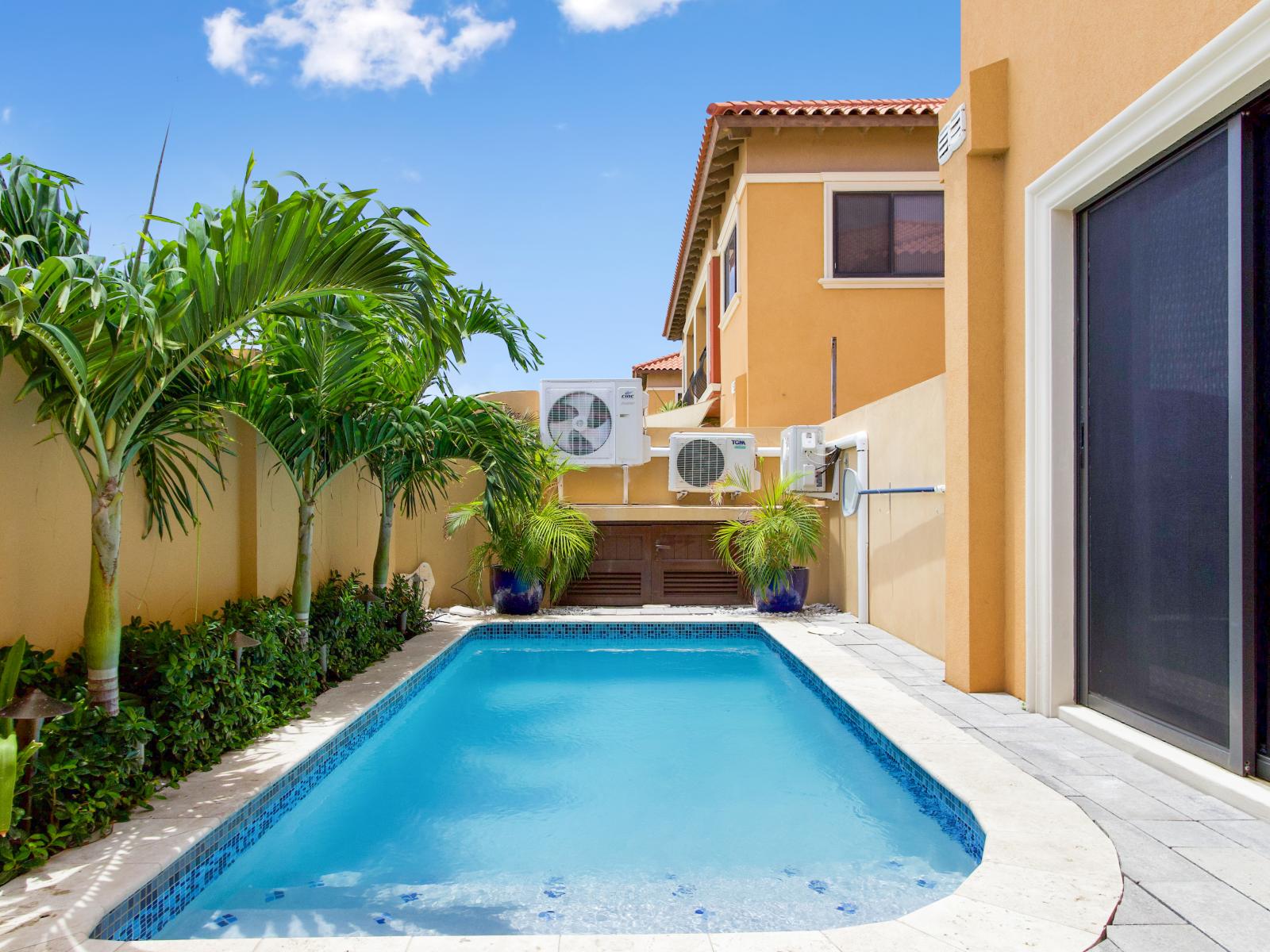 Refresh and unwind: our pool with a stylish lounge area invites you to relax and soak up the sun.