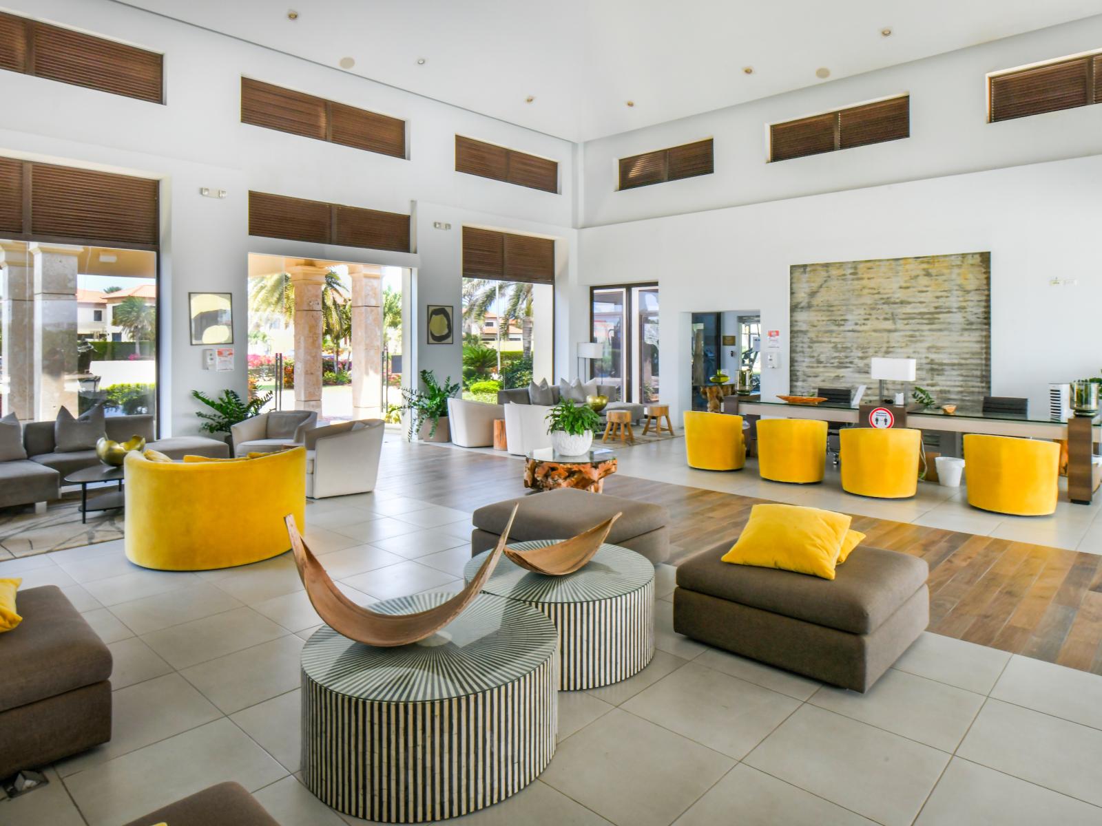 The lobby boasts plenty of comfortable seating, creating a perfect spot for guests to gather, relax, and enjoy the surroundings.