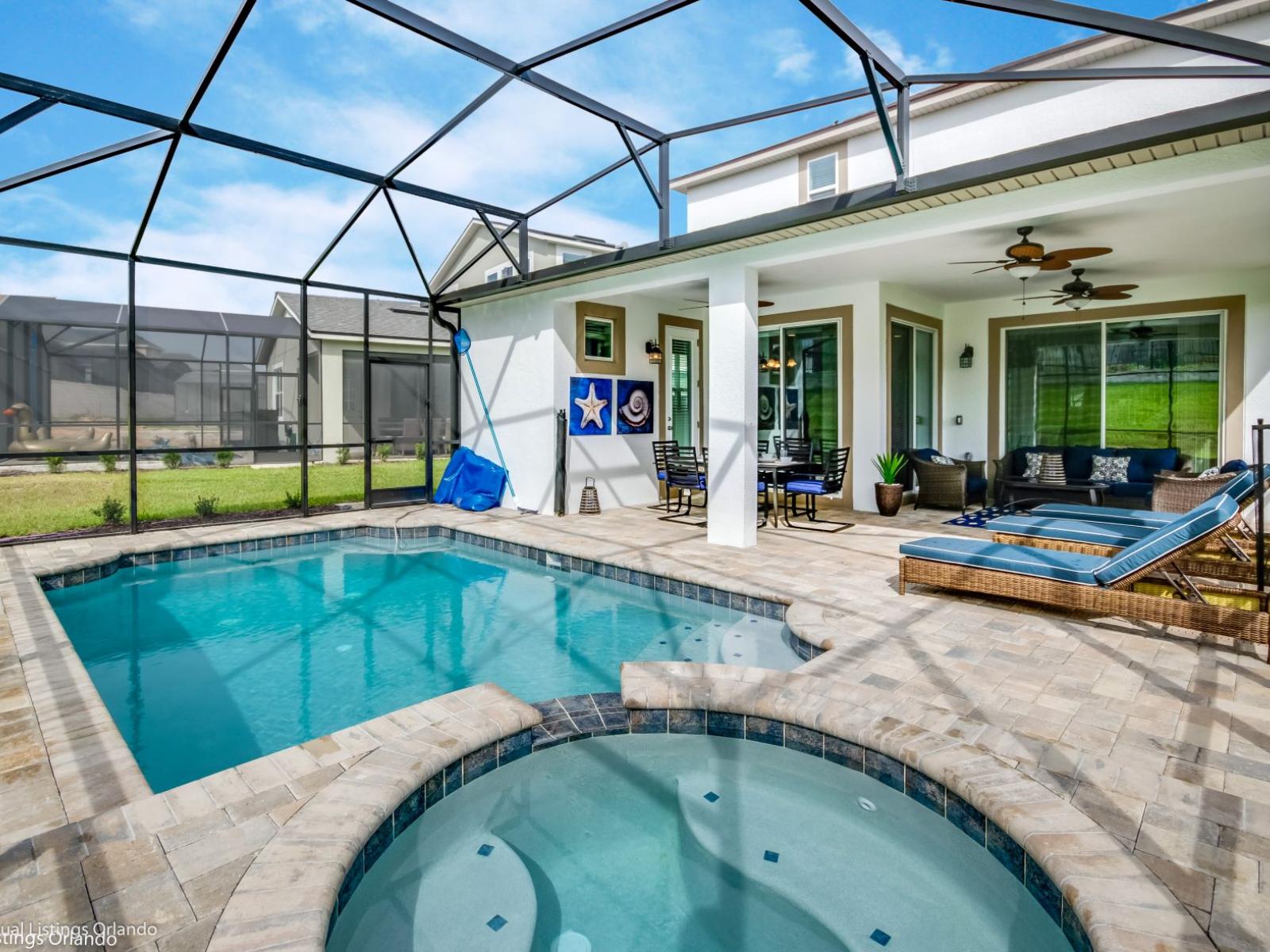 Peasant private pool area of the villa in Kissimmee Florida - Sparkling waters beckoning you to take a leisurely swim - Inviting poolside loungers for basking in the sunshine