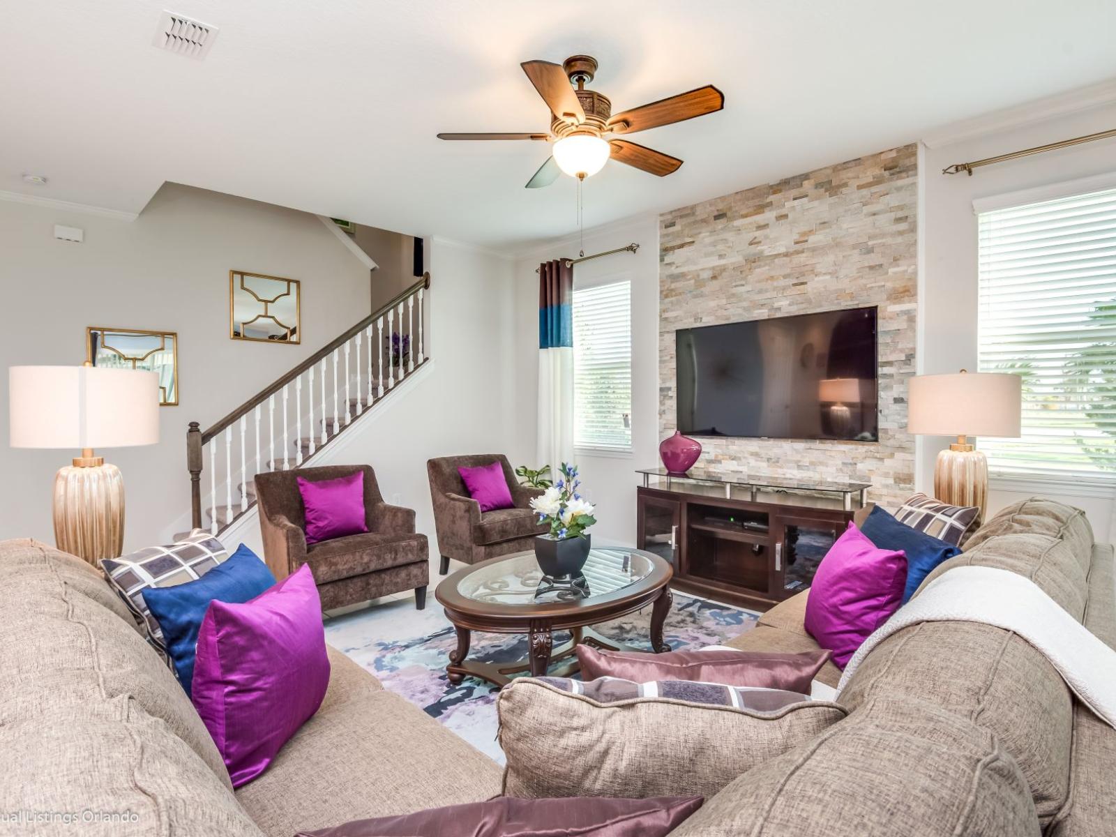 Inviting living area of the villa in Kissimmee Florida - Generous seating arrangements for socializing and lounging - Smart TV for entertainment - Indulge in relaxation in our spacious living area