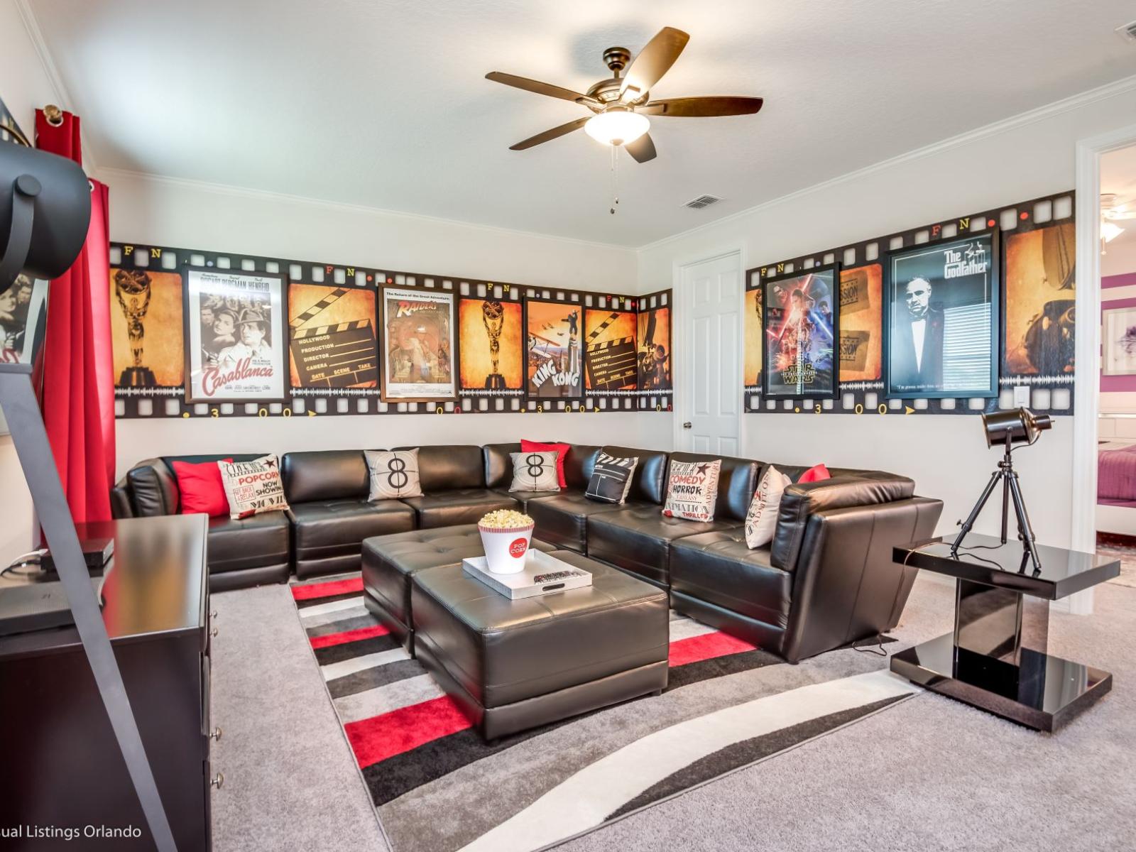 The entertainment room with movie murals on the wall transforms your space into a cinematic oasis. This room sets the stage for unforgettable movie nights.