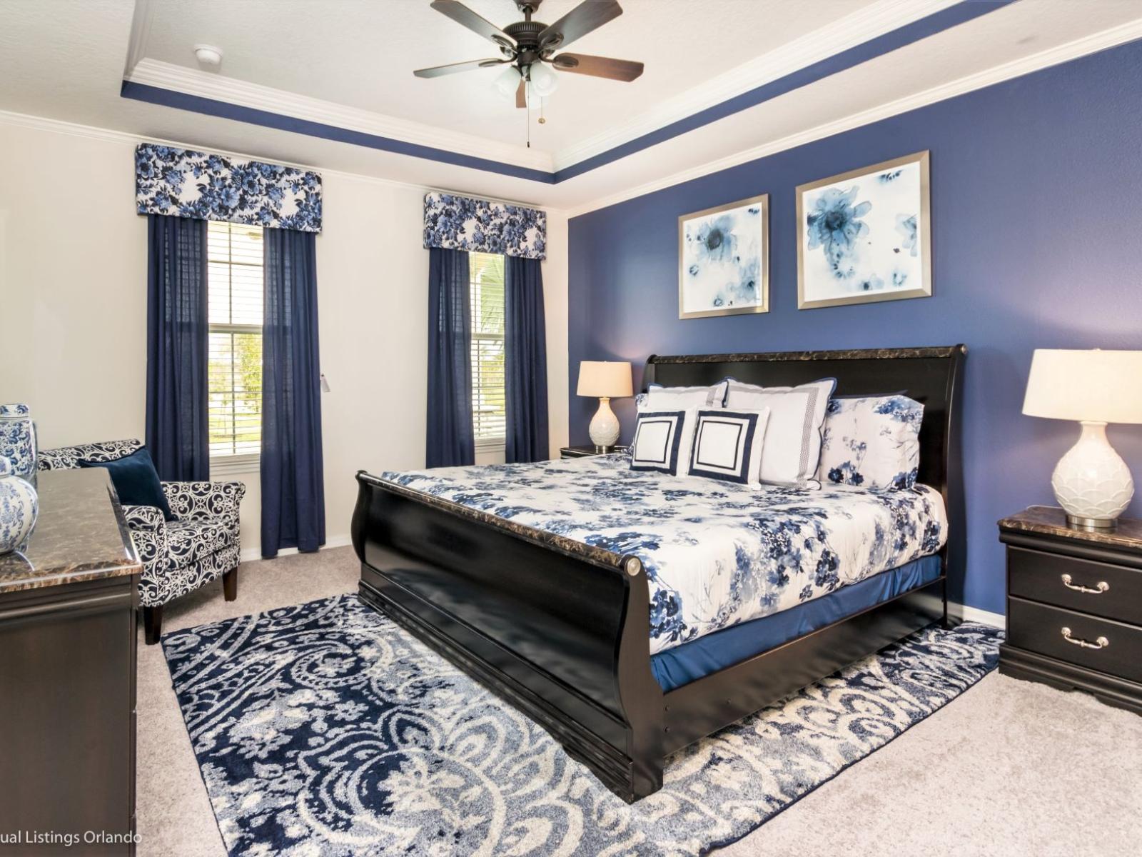 Inviting bedroom of the villa in Kissimmee Florida -  Stylish decor that complements the space - Plush bedding and pillows for a luxurious feel - Smart TV for movie nights or relaxation