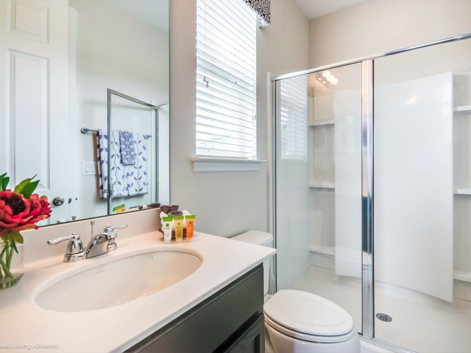 Indulge in spa-like spacious bathroom retreat, offer glass-enclose walk-in shower stall