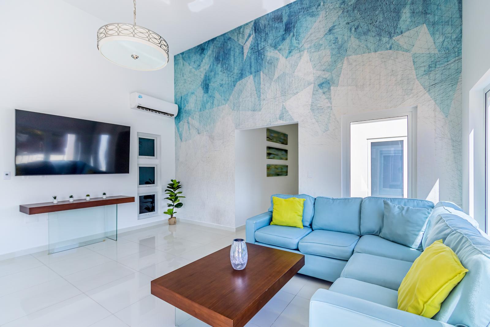 Extravagant Living Area of the 3BR house in Noord Aruba - Beautiful living room with an open layout, creating a sense of spaciousness - Smart TV and Netflix - Stylish furniture arrangement providing comfort and a cohesive look - Comfy Sofas
