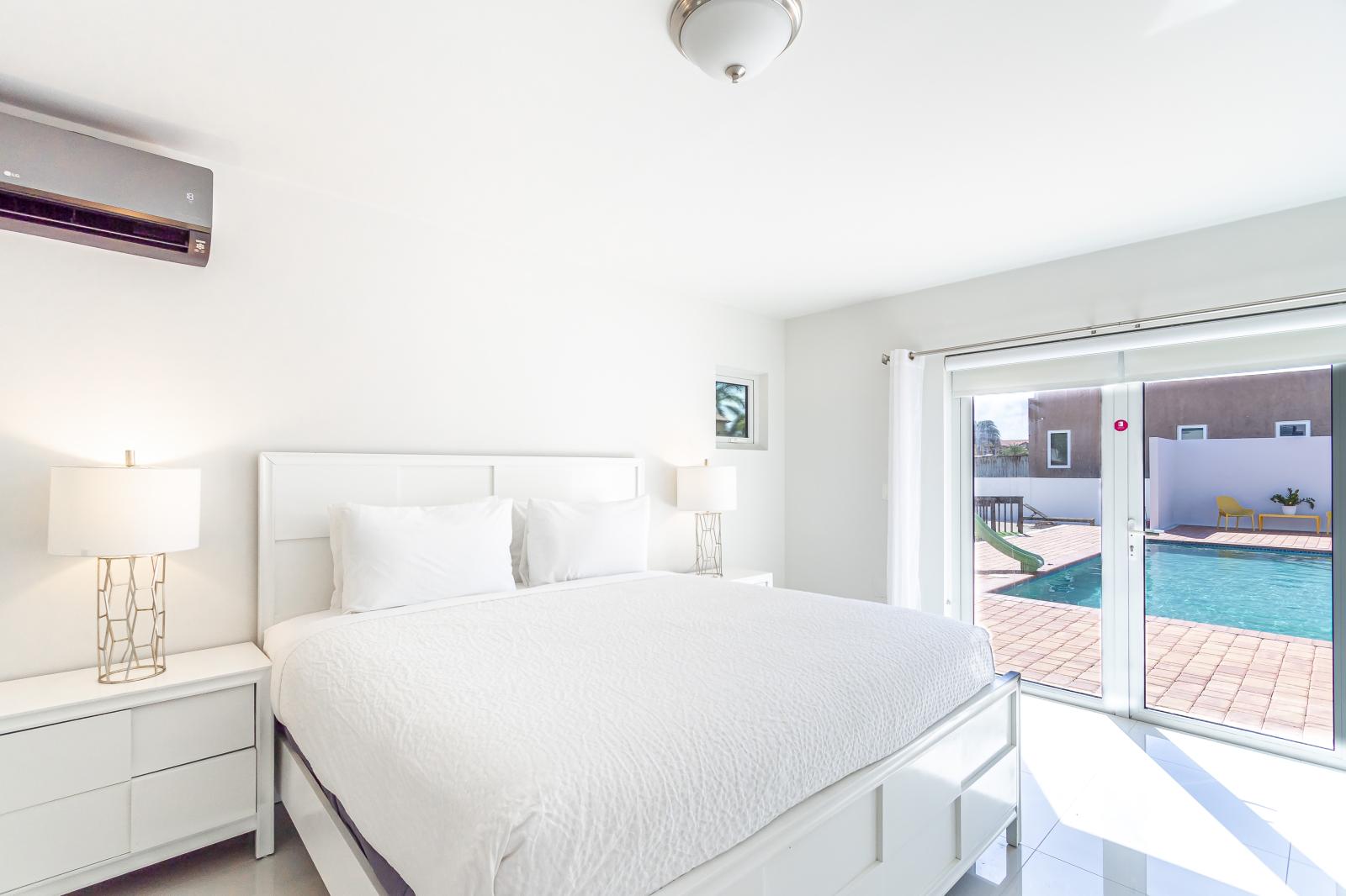 Resplendent Bedroom of the 3BR house in Noord Aruba - Modern bedroom with sleek design and natural light - King Size Comfy Bed - Cozy retreat with a plush bed, perfect for relaxation