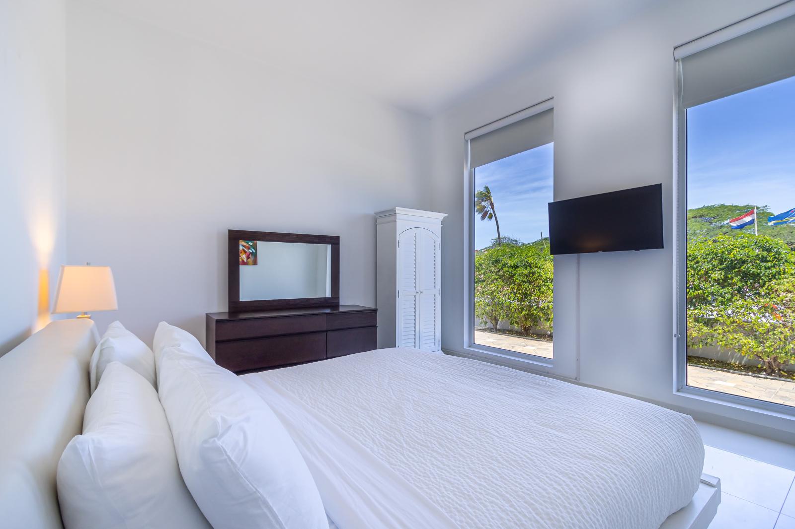 Bedroom 2 comes complete with a King size bed upon a trendy low-profile frame