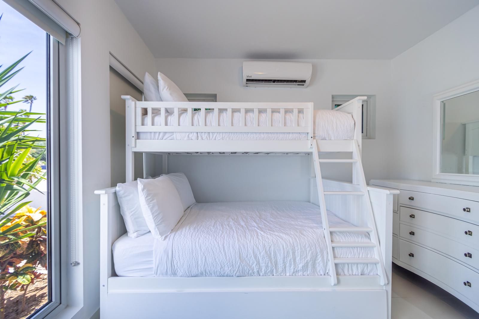 Versatile Comfort: Bedroom 3 is Perfect for You and Your Little Ones, Offering Flexible Sleeping Arrangements and Cozy Accommodations for Unforgettable Family Memories