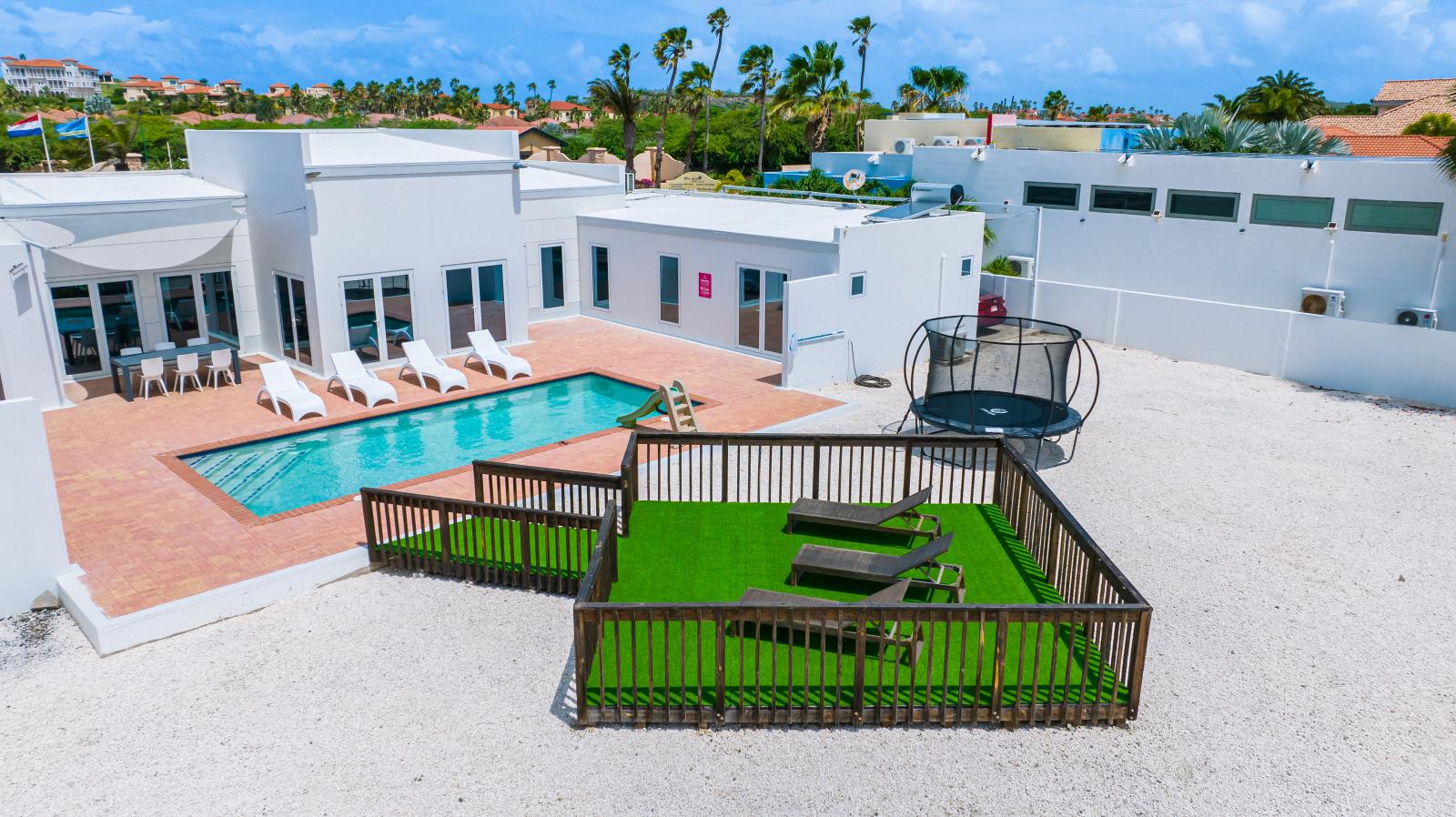 Experience Outdoor Elegance: Step into Our Beautifully Manicured Backyard Patio, Offering a Unique and Serene Setting for Relaxation and Entertainment