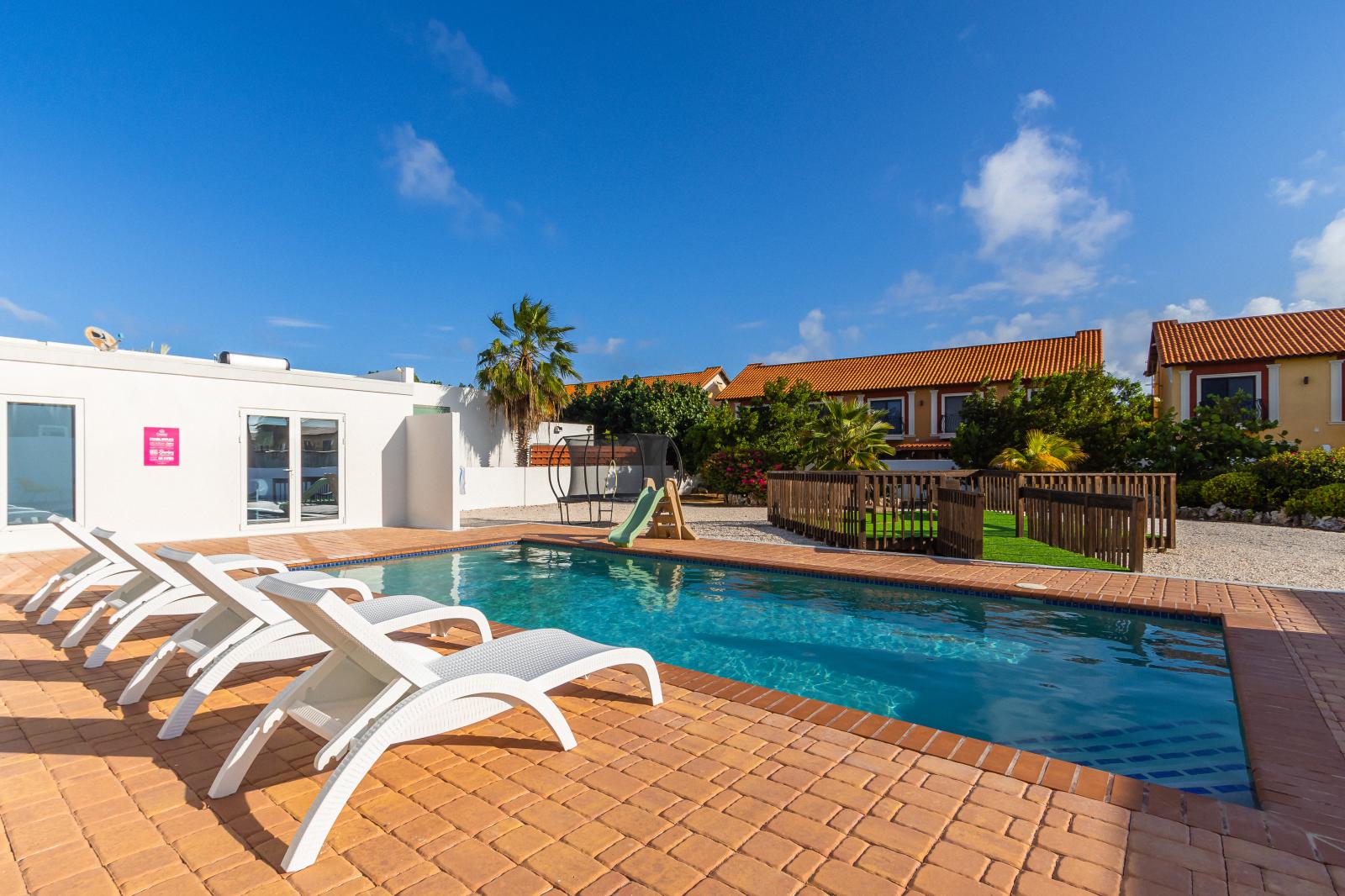 Take the plunge into luxury with our expansive pool. Stretch out, swim laps, or simply soak in the spaciousness of your aquatic haven.