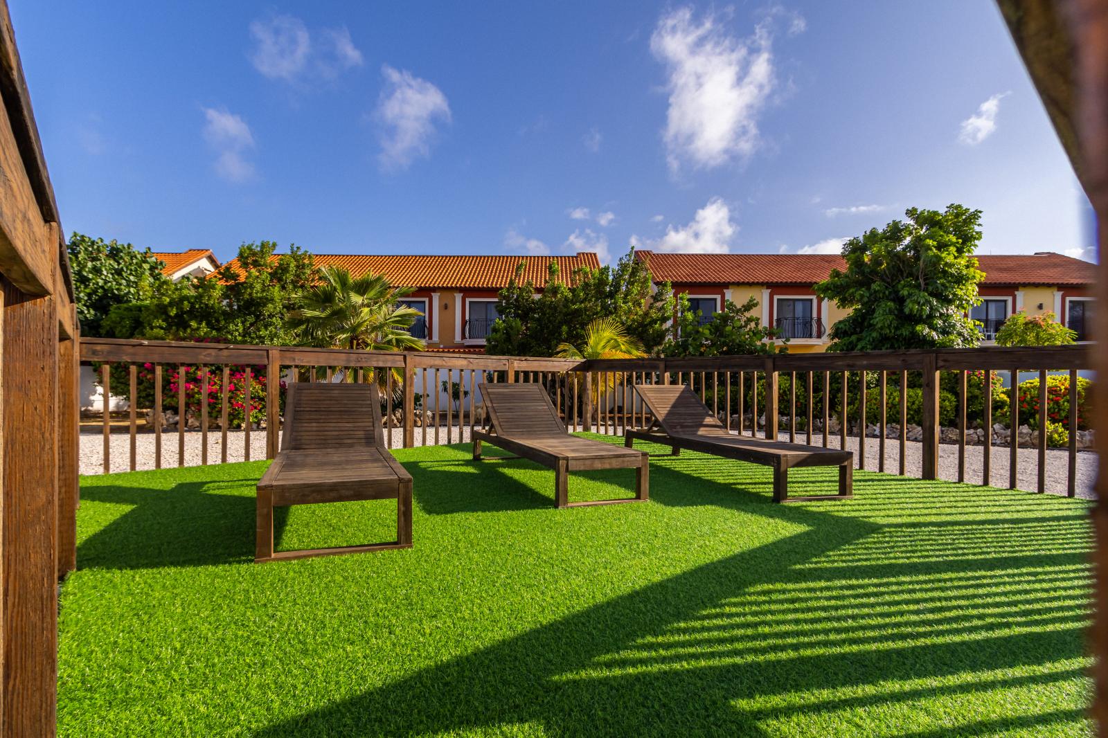 Escape to our lush green lounge area, where soft grass invites you to unwind beneath the open sky. Perfect for picnics, relaxation, and enjoying the great outdoors.