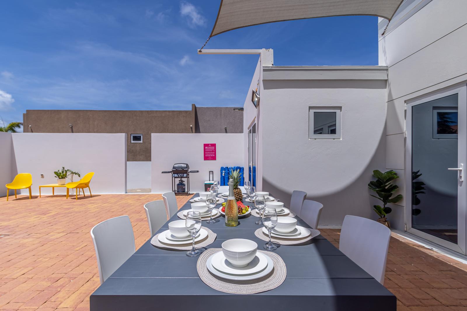 Elevate your dining experience under the open sky with our inviting outdoor table. From sunrise breakfasts to sunset feasts, create unforgettable moments in the fresh air.