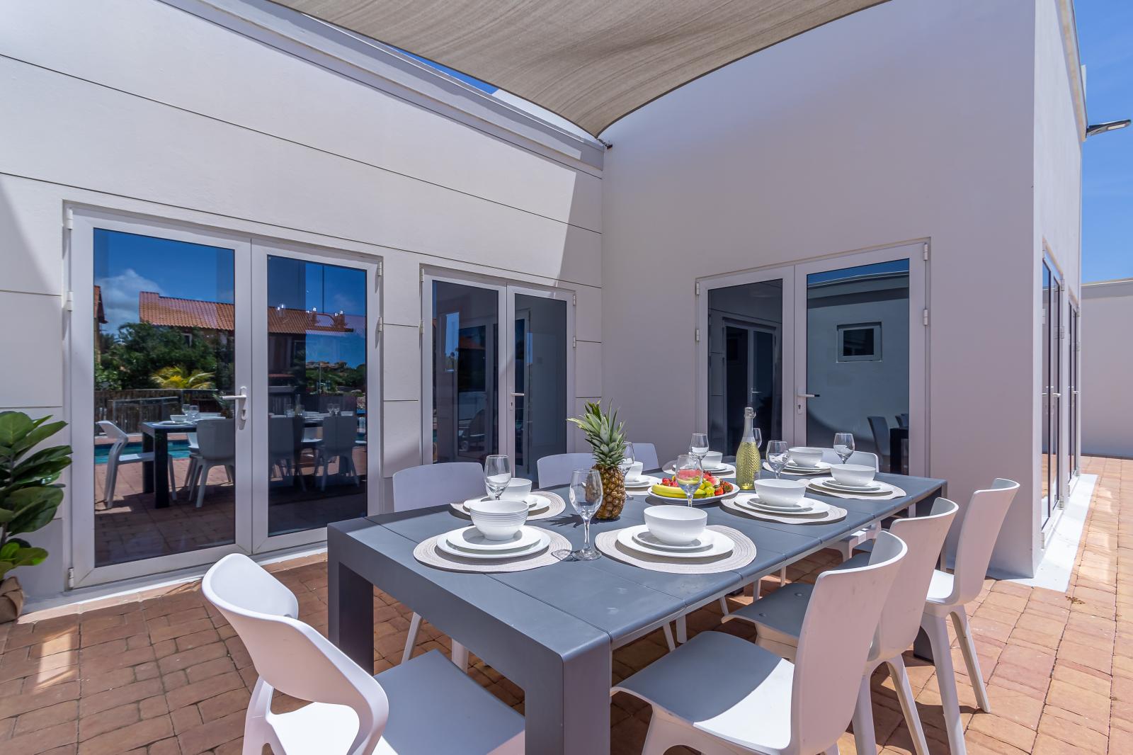 Escape the midday sun and dine in comfort at our shaded outdoor table. Enjoy cool breezes and delightful meals without the worry of harsh sunlight, a perfect retreat for any time of day.