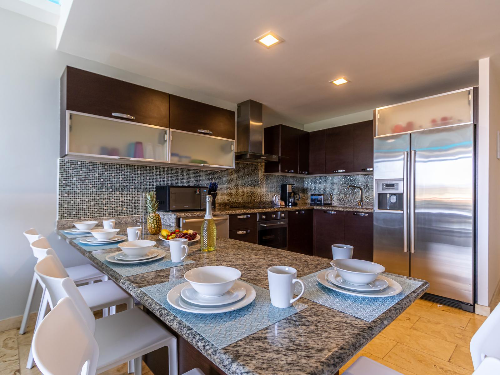 Dining Area of the 2BR Condo in Oranjestad Aruba at kitchen Bar - 5 Persons Dining - Comfortable chairs - Intimate ambiance created through soft lighting - Modern Design