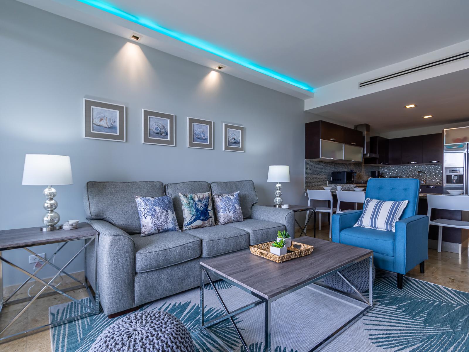 Breathtaking Living Area of the 2BR Condo in Oranjestad Aruba - Elegantly decorated space with a neutral color palette for a timeless appeal - Private Balcony with outstanding view and cozy sitting - Smart TV and Netflix